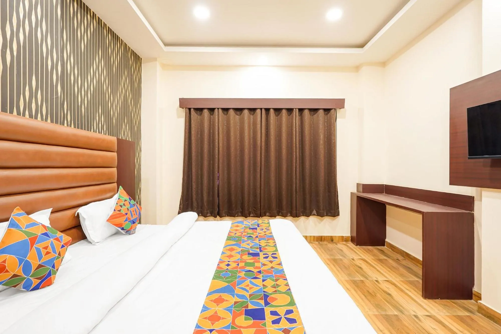 Bed in FabHotel Palm Bliss