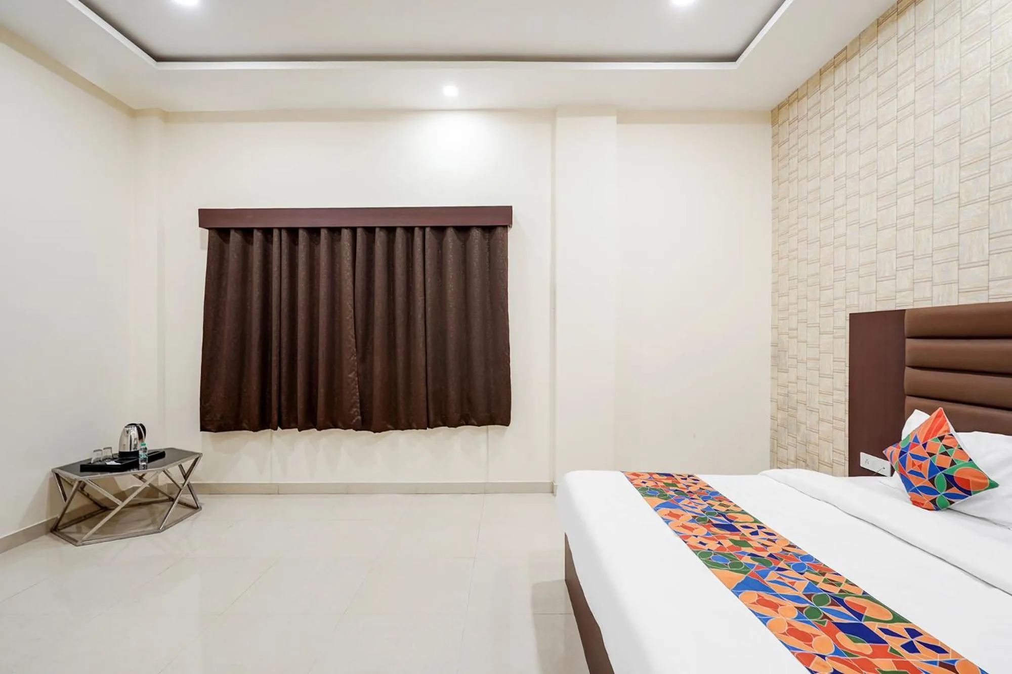 Bed in FabHotel Palm Bliss