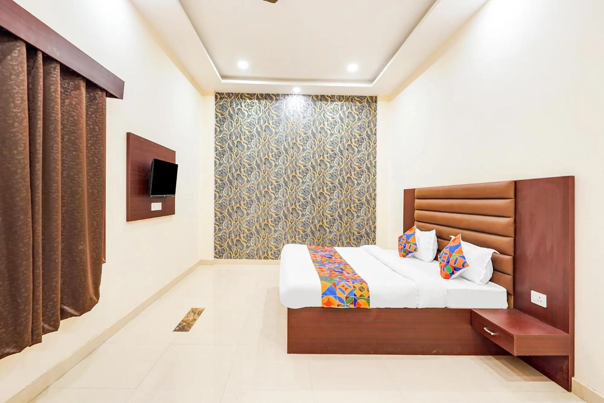 Bed in FabHotel Palm Bliss