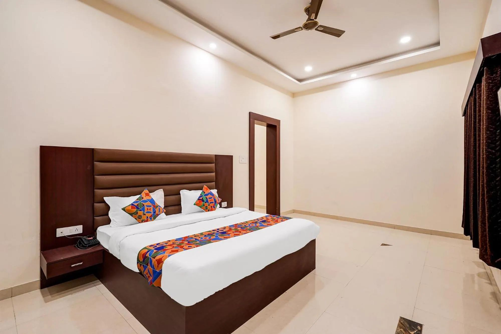 Bed in FabHotel Palm Bliss