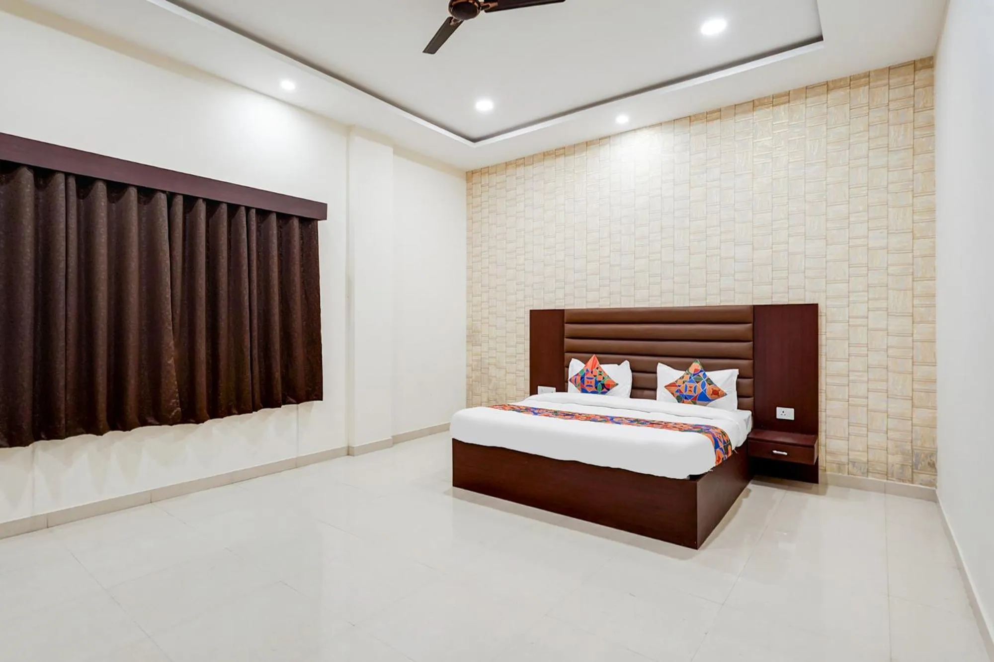 Bed in FabHotel Palm Bliss