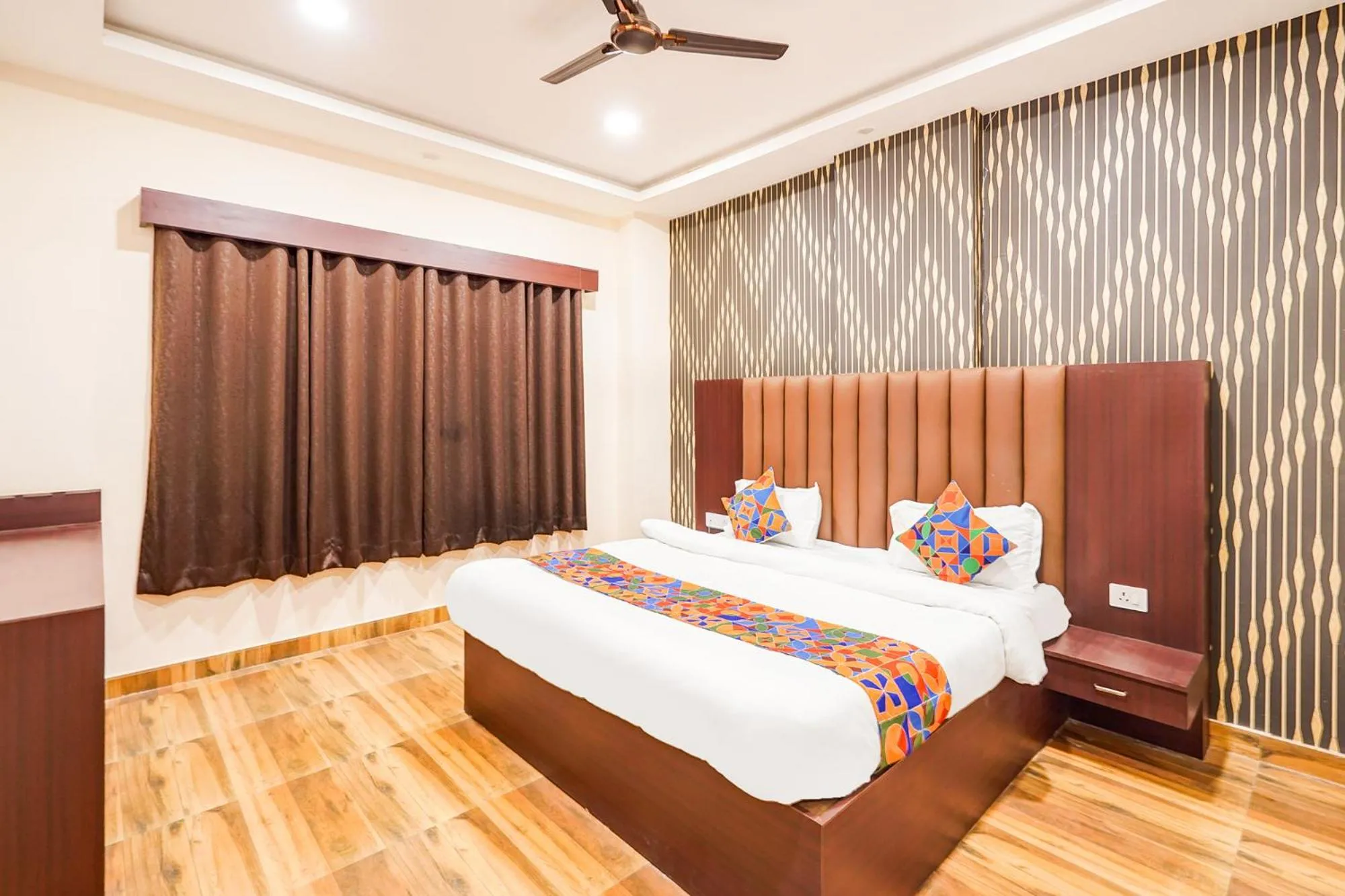 Bed in FabHotel Palm Bliss