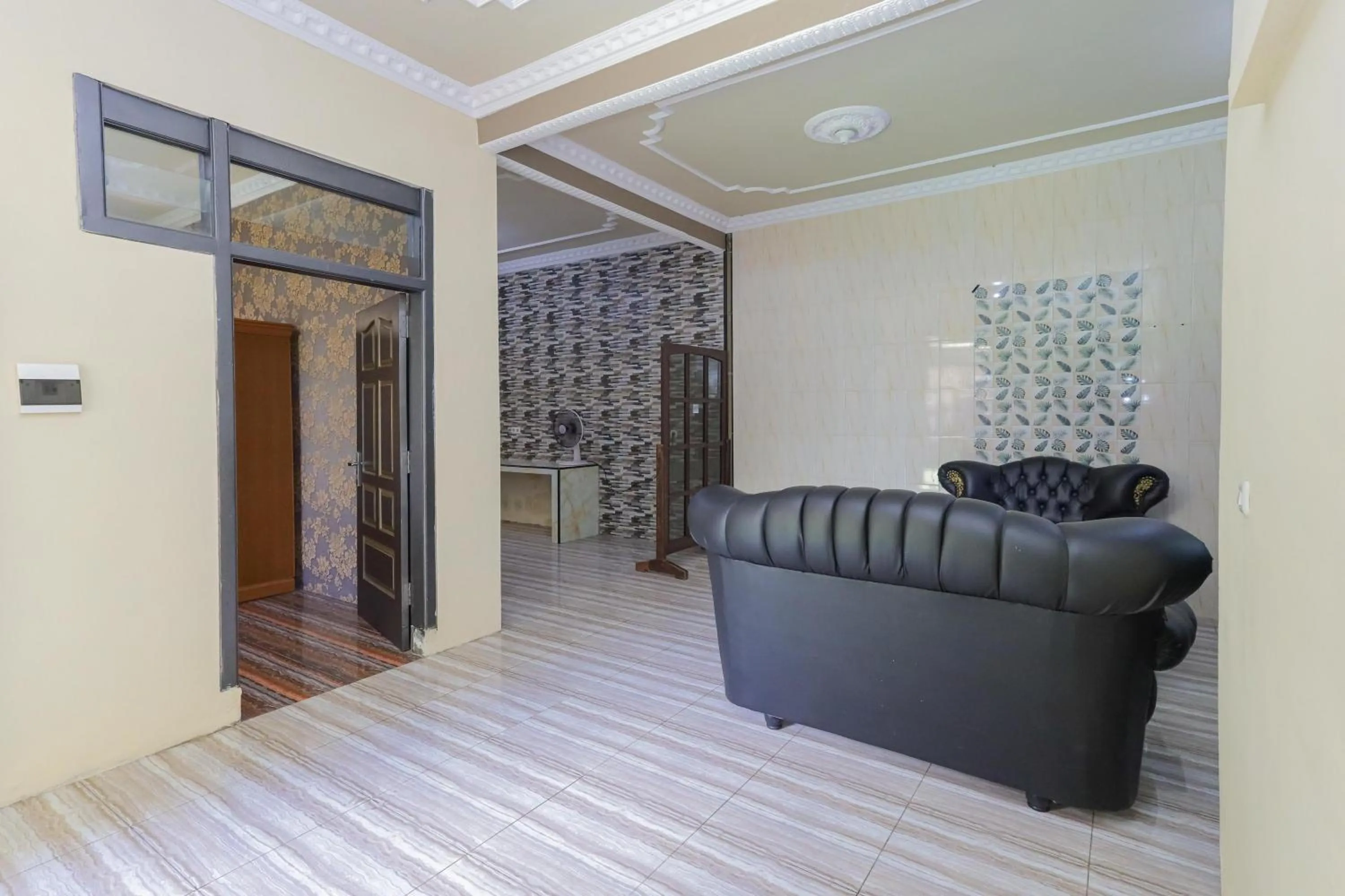 Living room in RedDoorz Plus @ Villa Bontes Batu