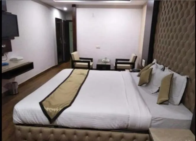 Bed in hotel puneet international