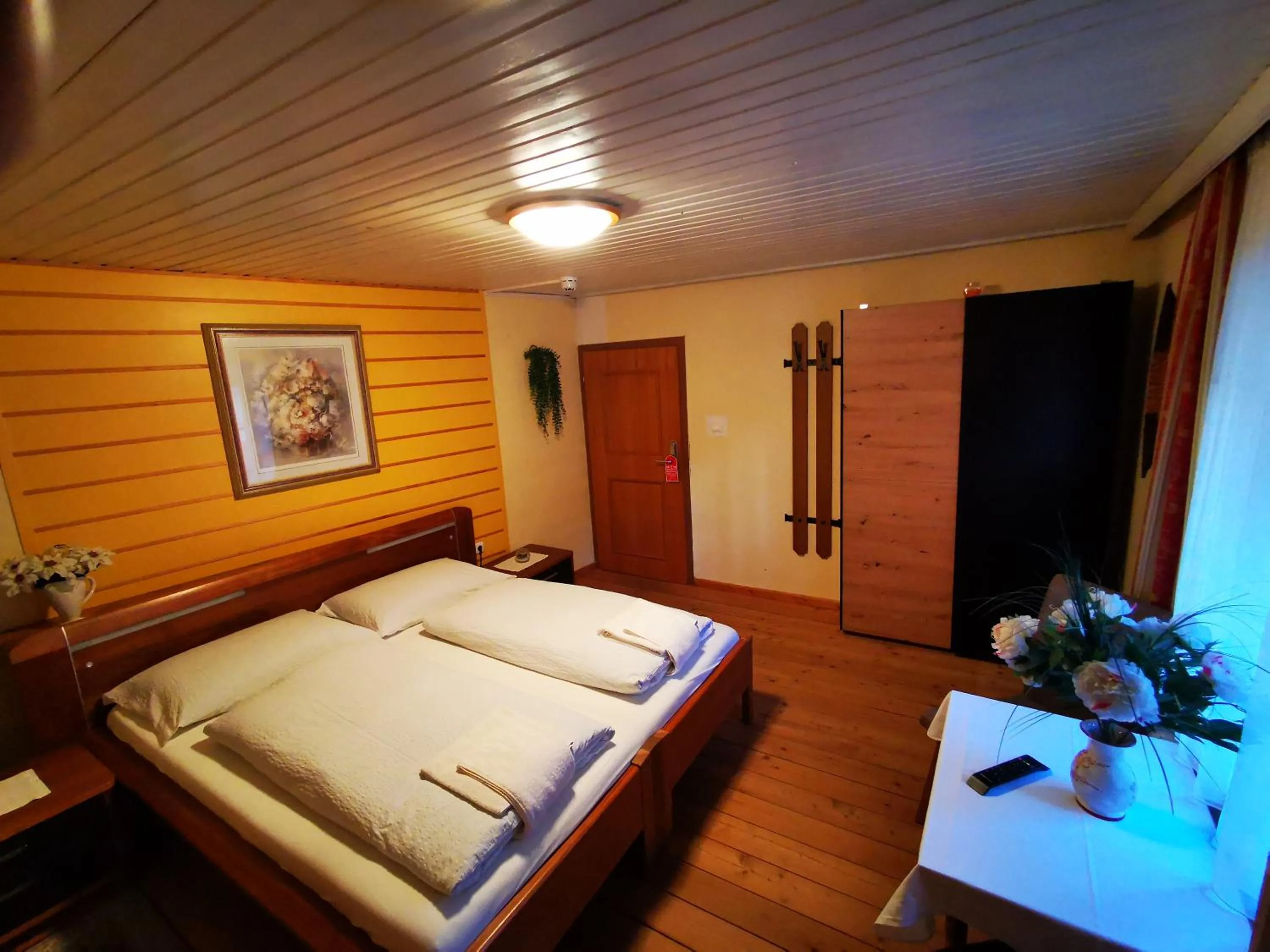 Photo of the whole room, Bed in Gasthof Geronimo