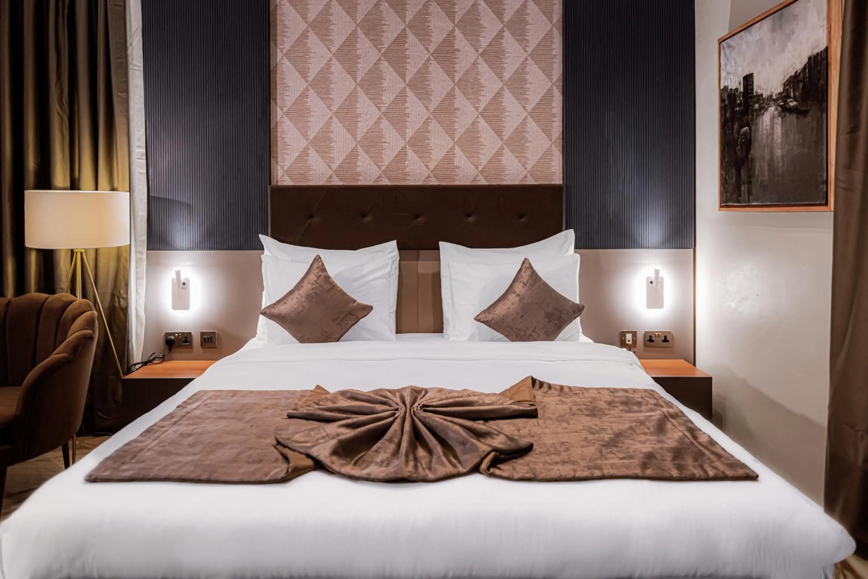 Bed in Wali's Suites