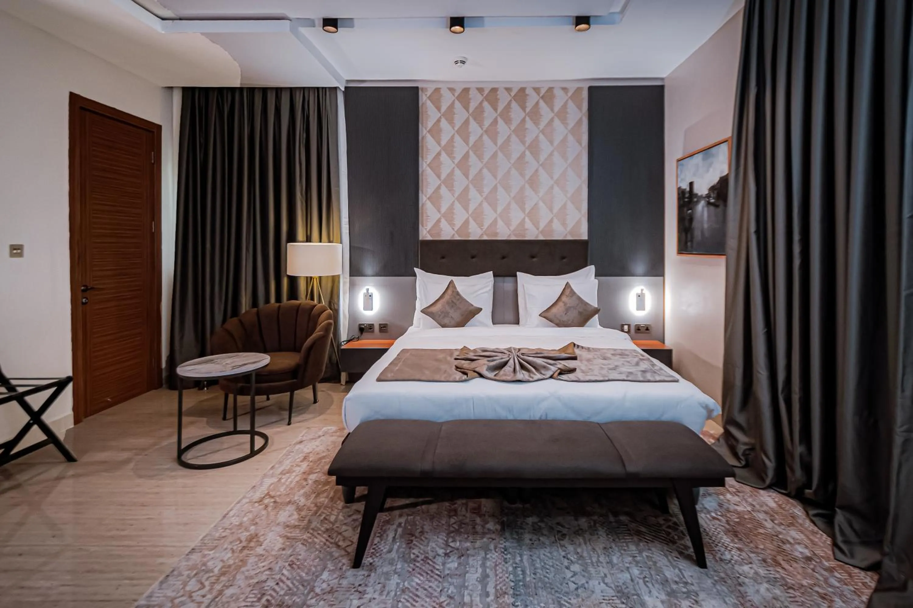 Bed in Wali's Suites