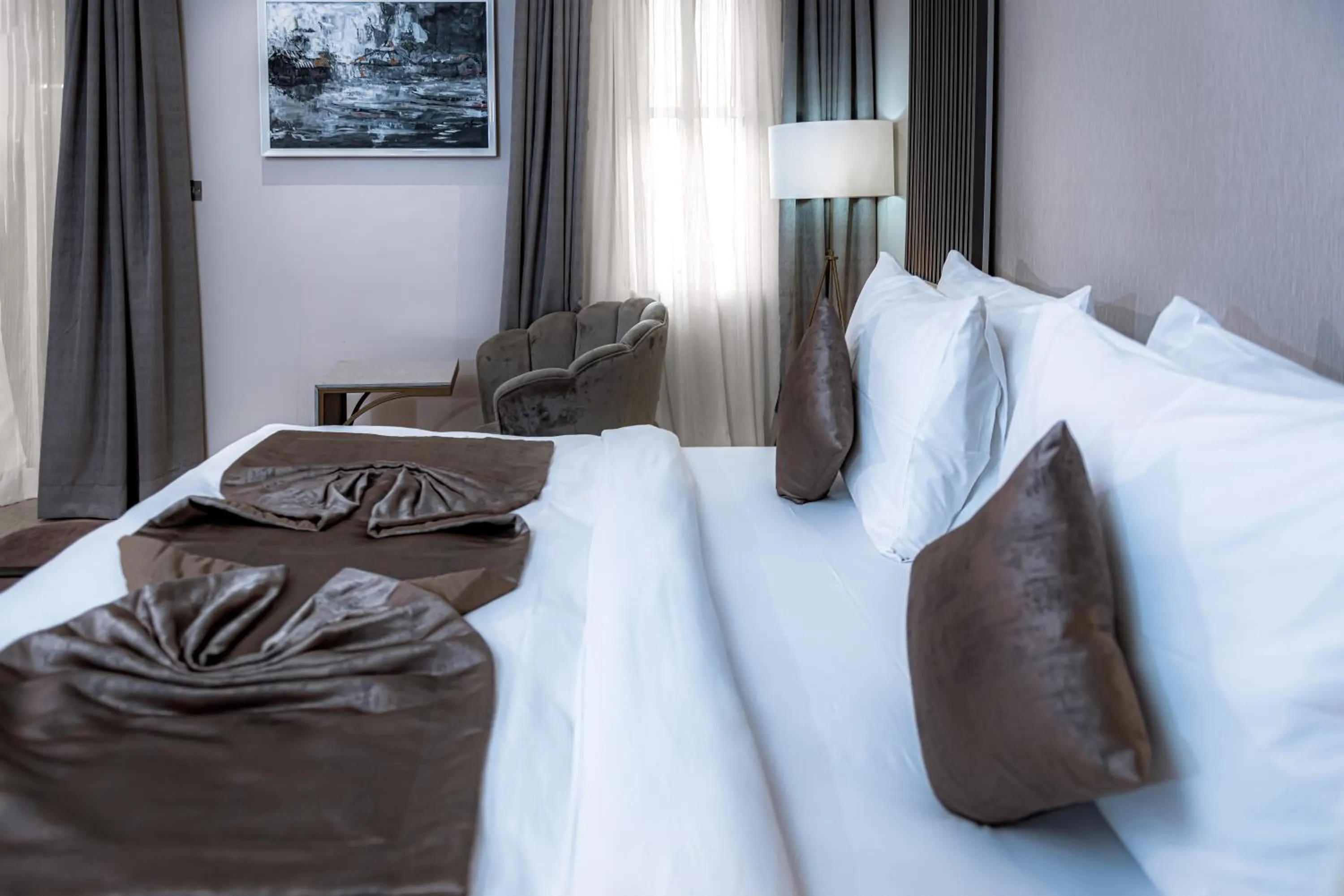 Bed in Wali's Suites