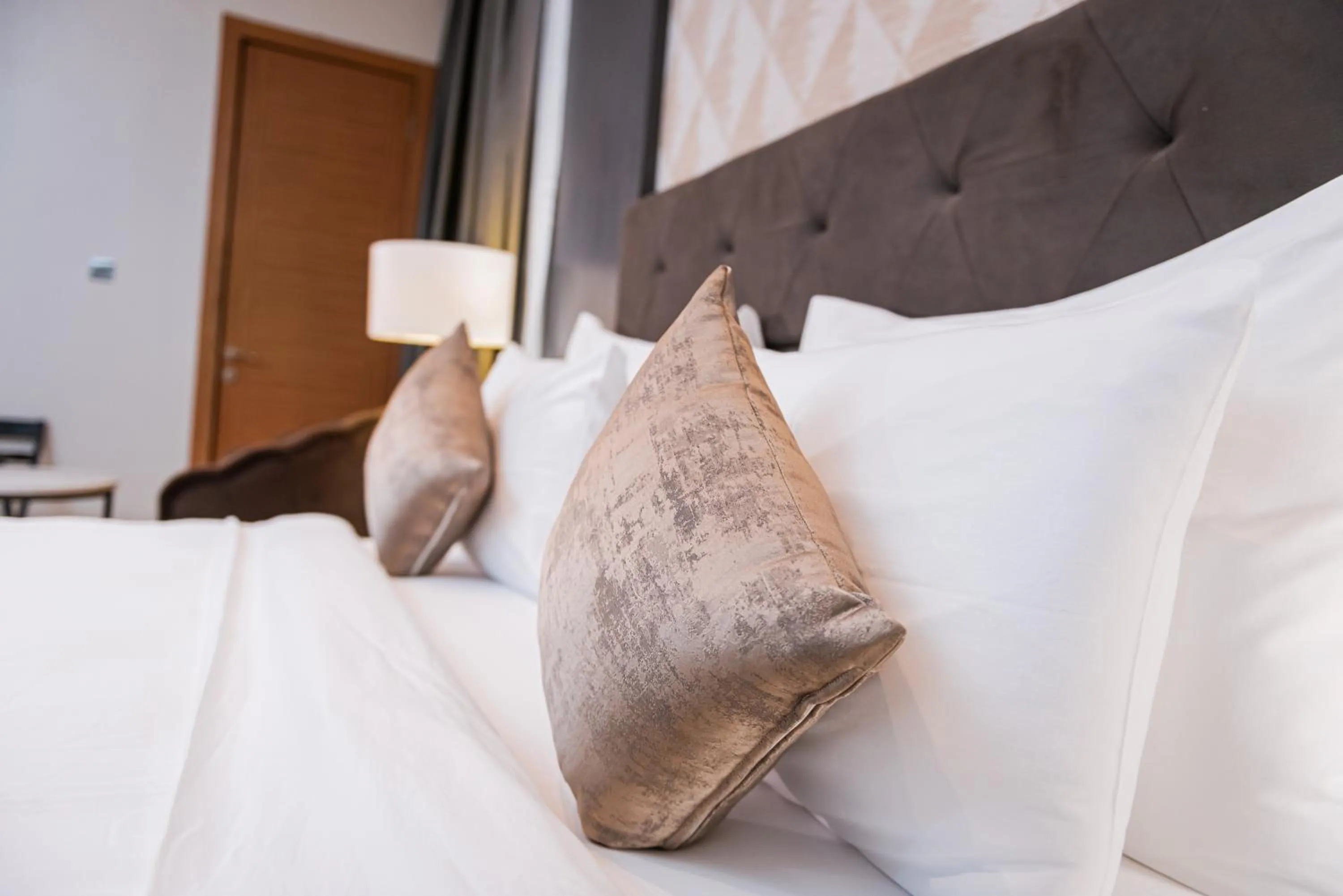 Bed in Wali's Suites