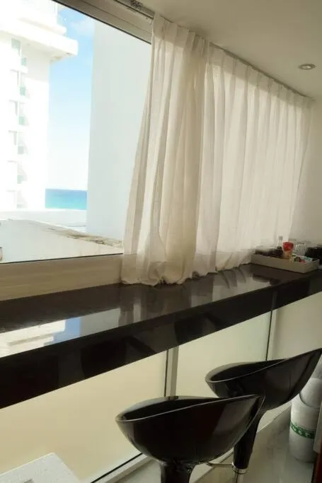 Seating area in Estudio 4 sobre playa, alberca, gimnasio, jacuzzi