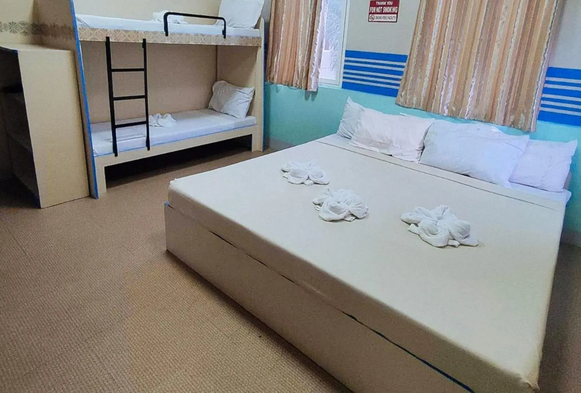 Bedroom, Bed in RedDoorz @ Isabelle Tourist Hotel Hinatuan Bedroom, Bed in RedDoorz @ Isabelle Tourist Hotel Hinatuan