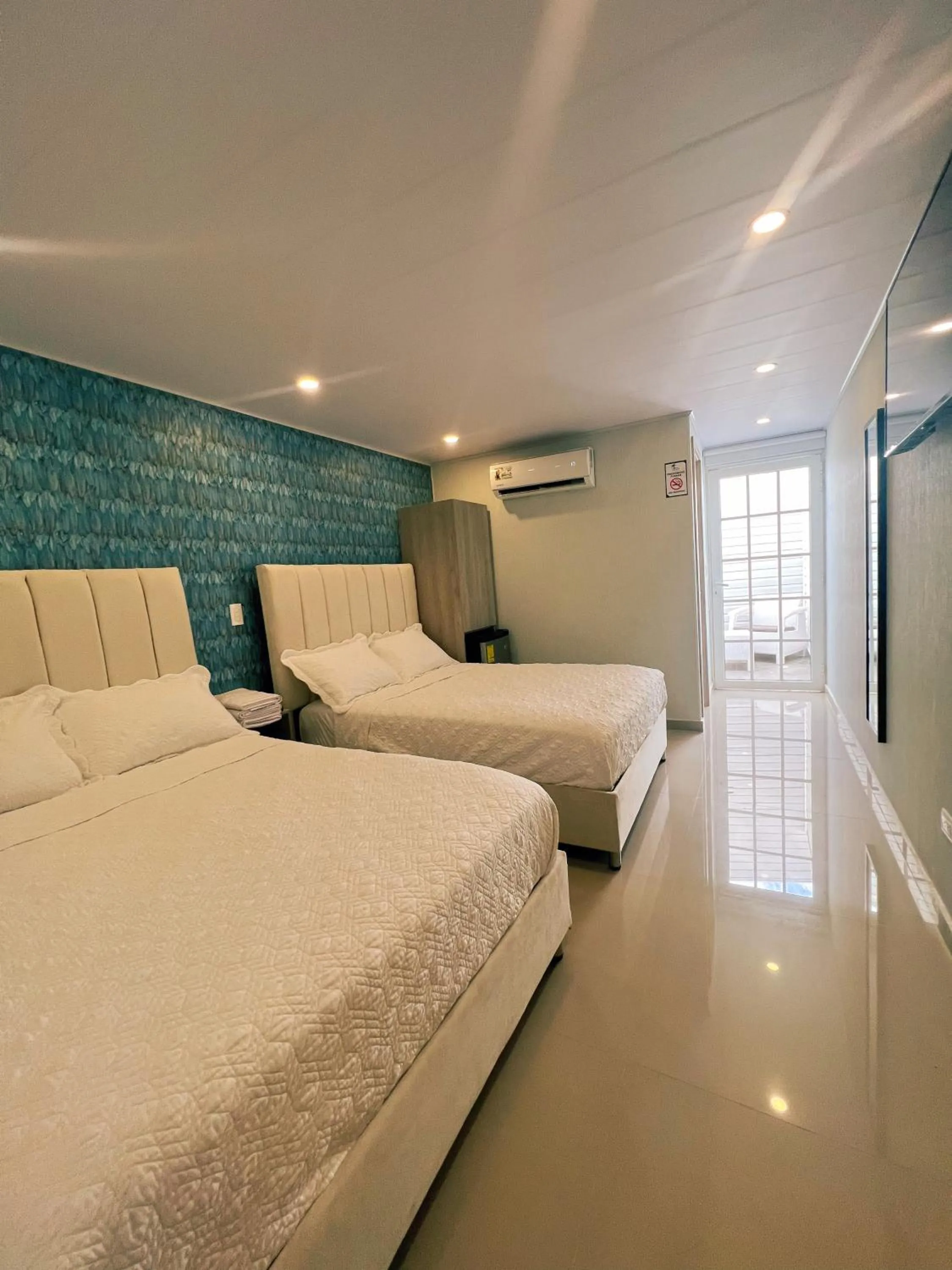 Quadruple Room with Private Bathroom - single occupancy in Oasis Hotel