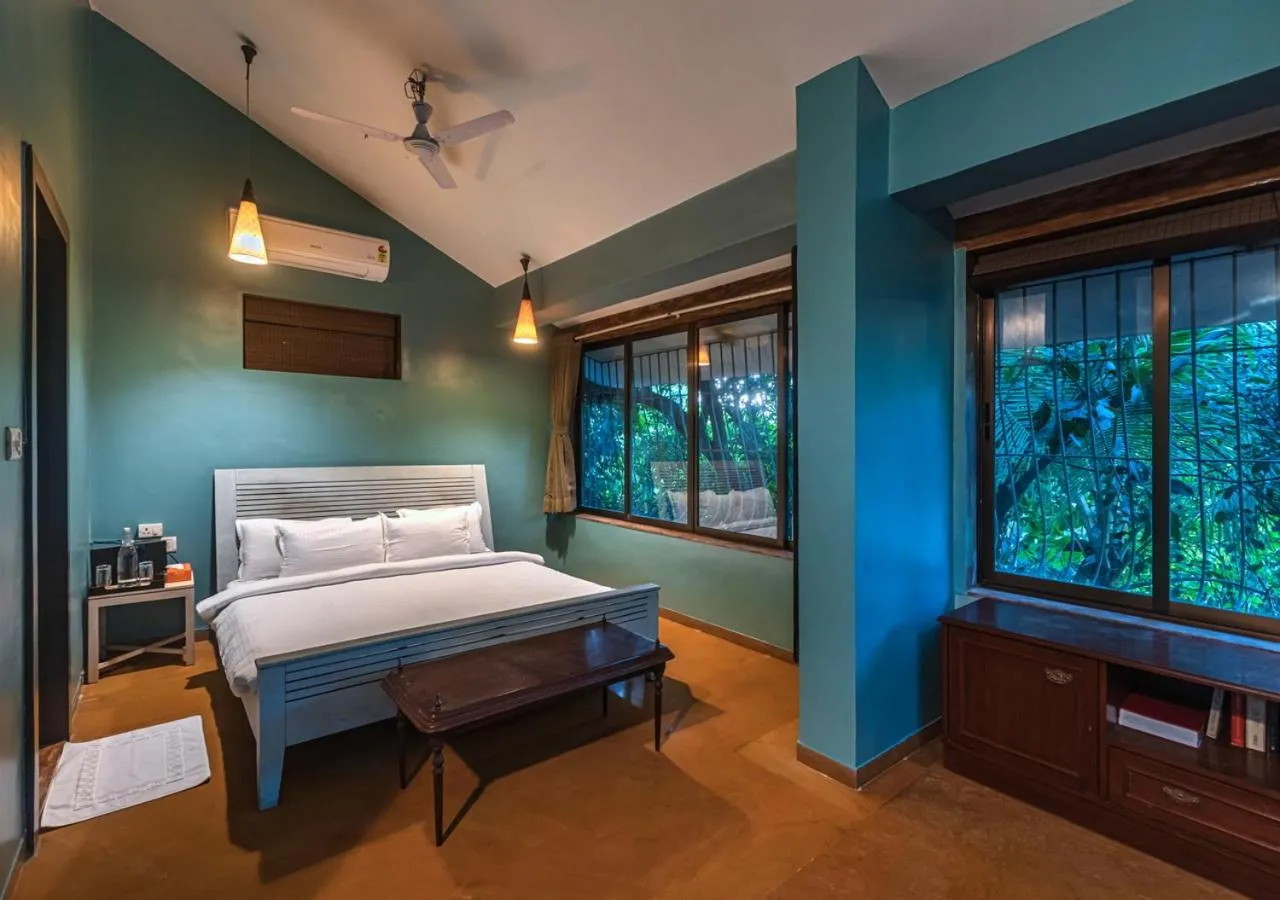Bed in SaffronStays Oriana, Alibaug