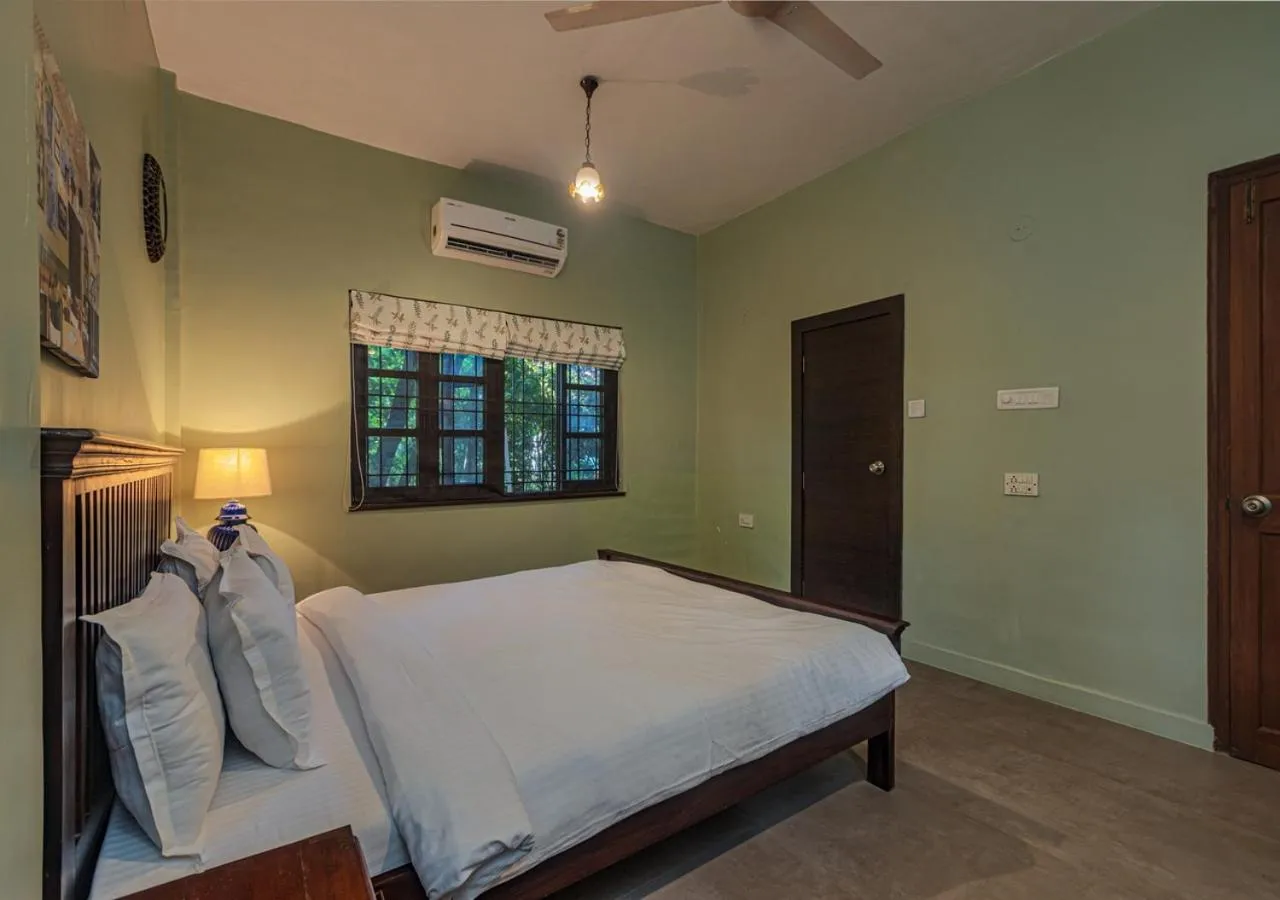 Bed in SaffronStays Oriana, Alibaug