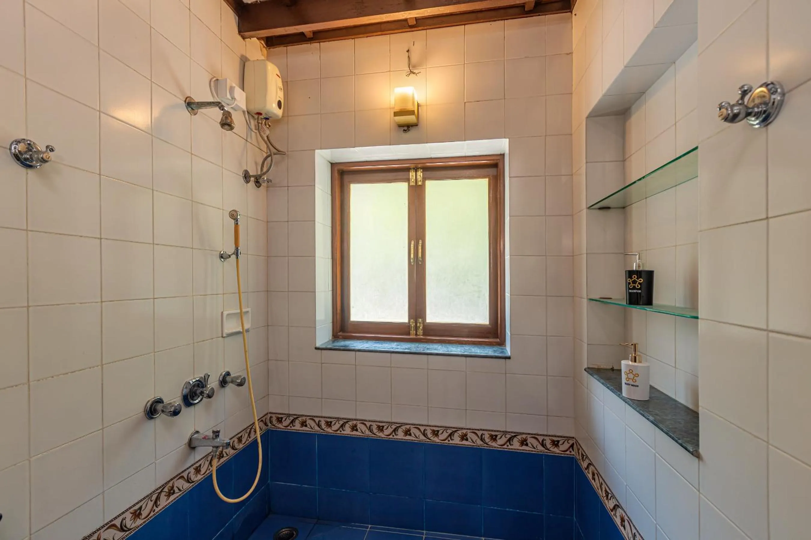 Shower in Saffronstays Alma Grove 3 BR Pet friendly with Pool & Nature View