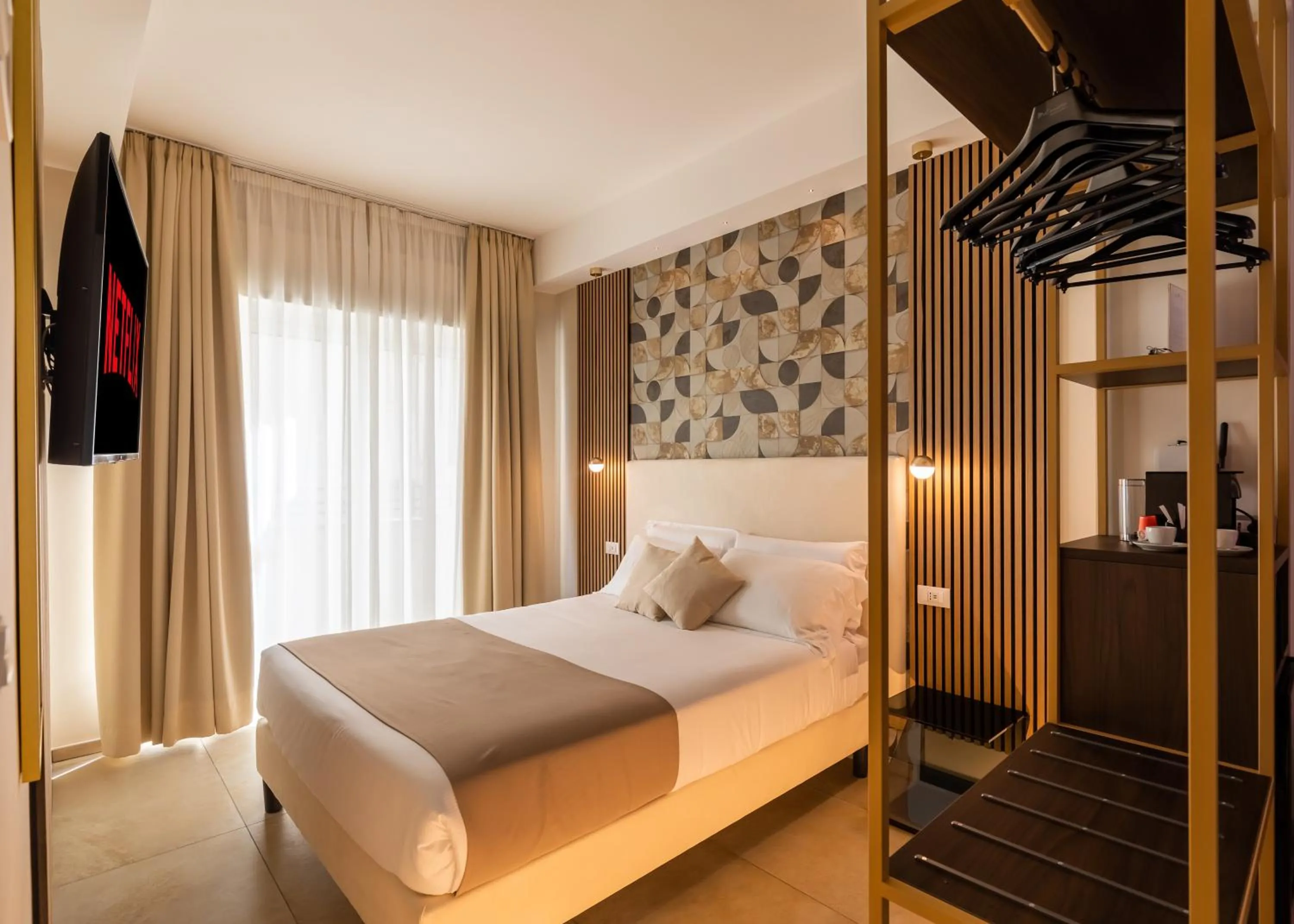 Bed in AlbaDea Suites&Jacuzzi