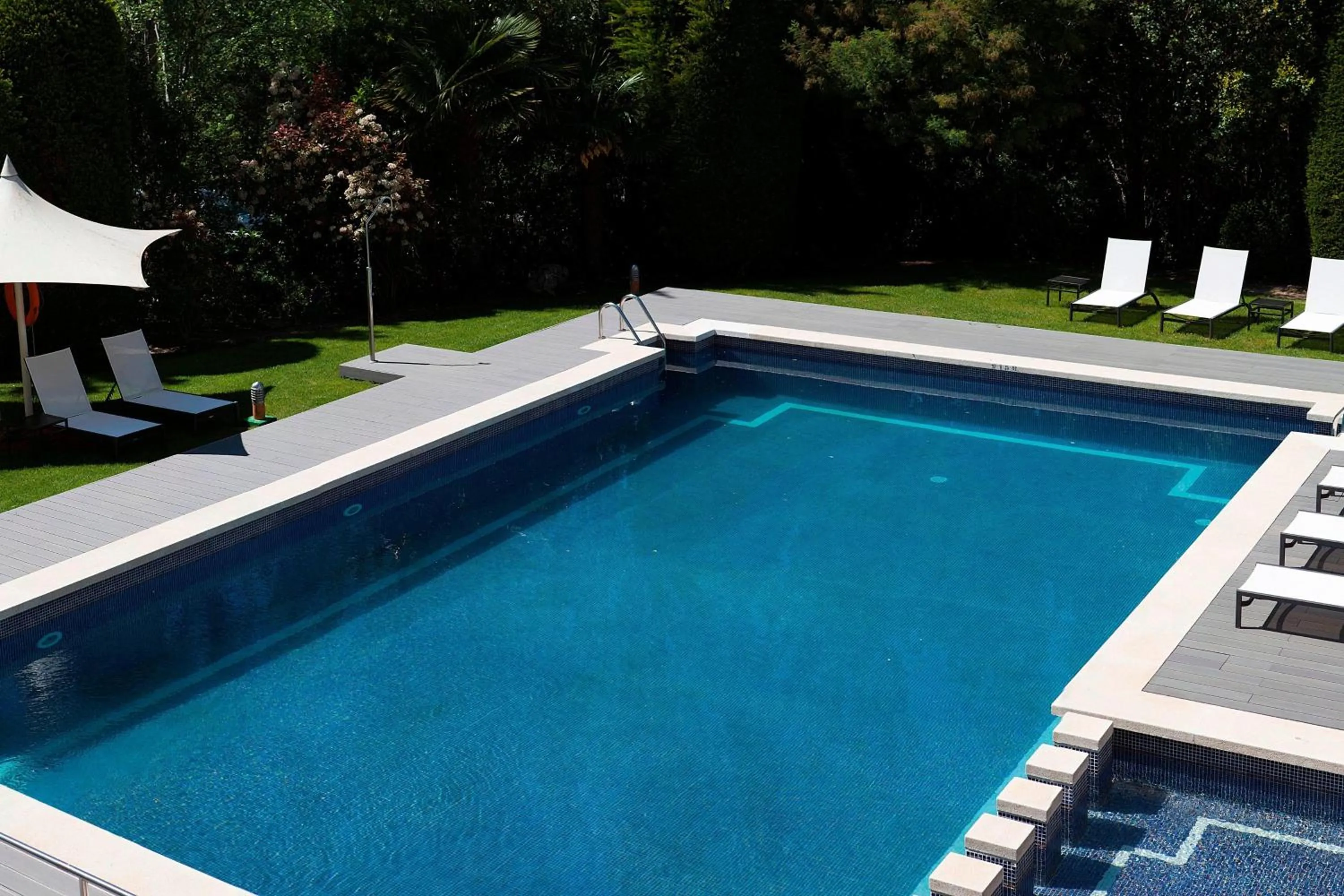 Swimming pool in AC Hotel San Cugat by Marriott