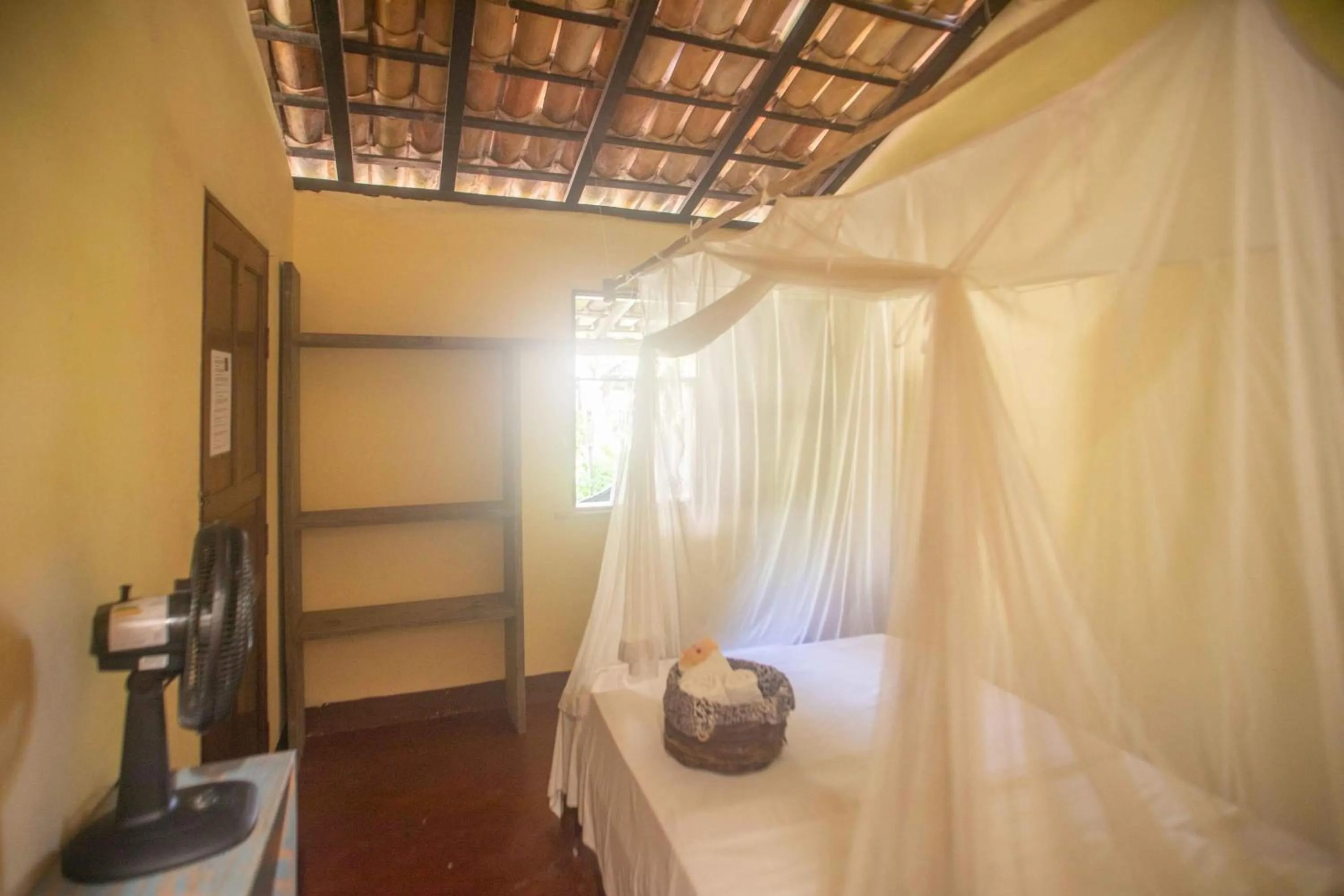 Bed in Pousada Deus mim Deu