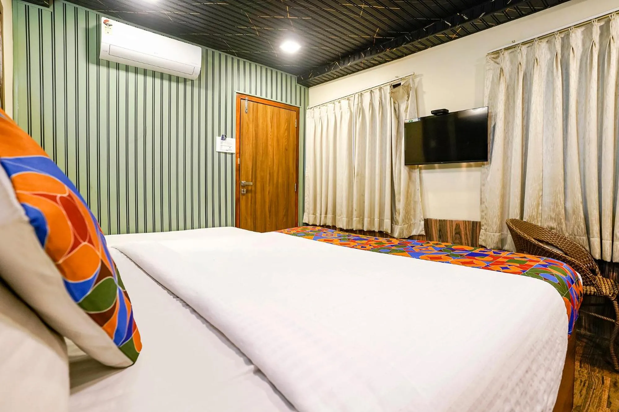 Bed in FabHotel Malali Residency