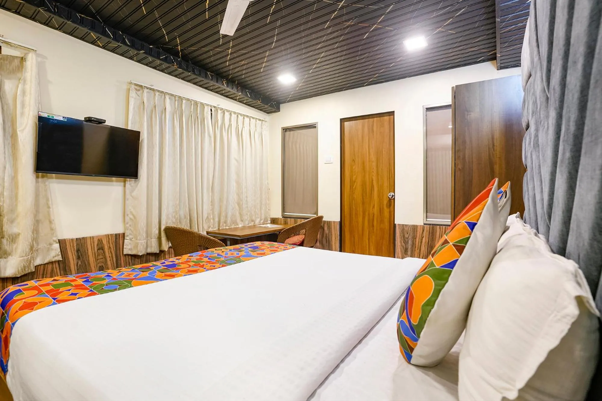 Bed in FabHotel Malali Residency