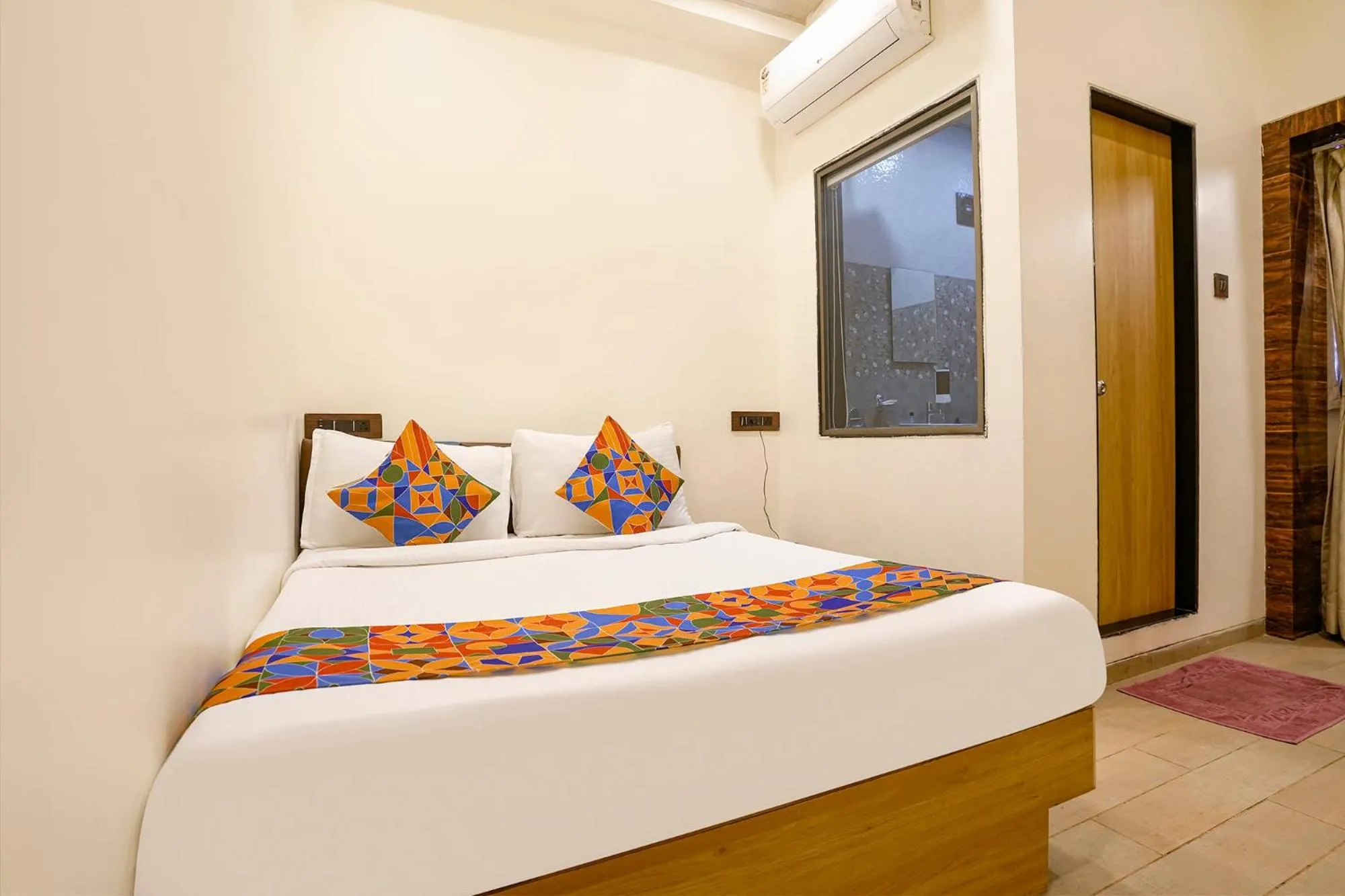 Bed in FabHotel Malali Residency
