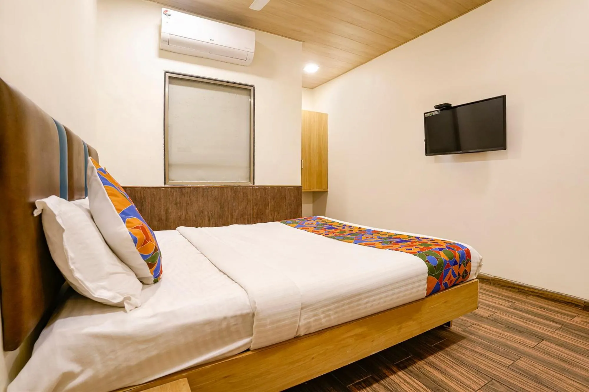 Bed in FabHotel Malali Residency