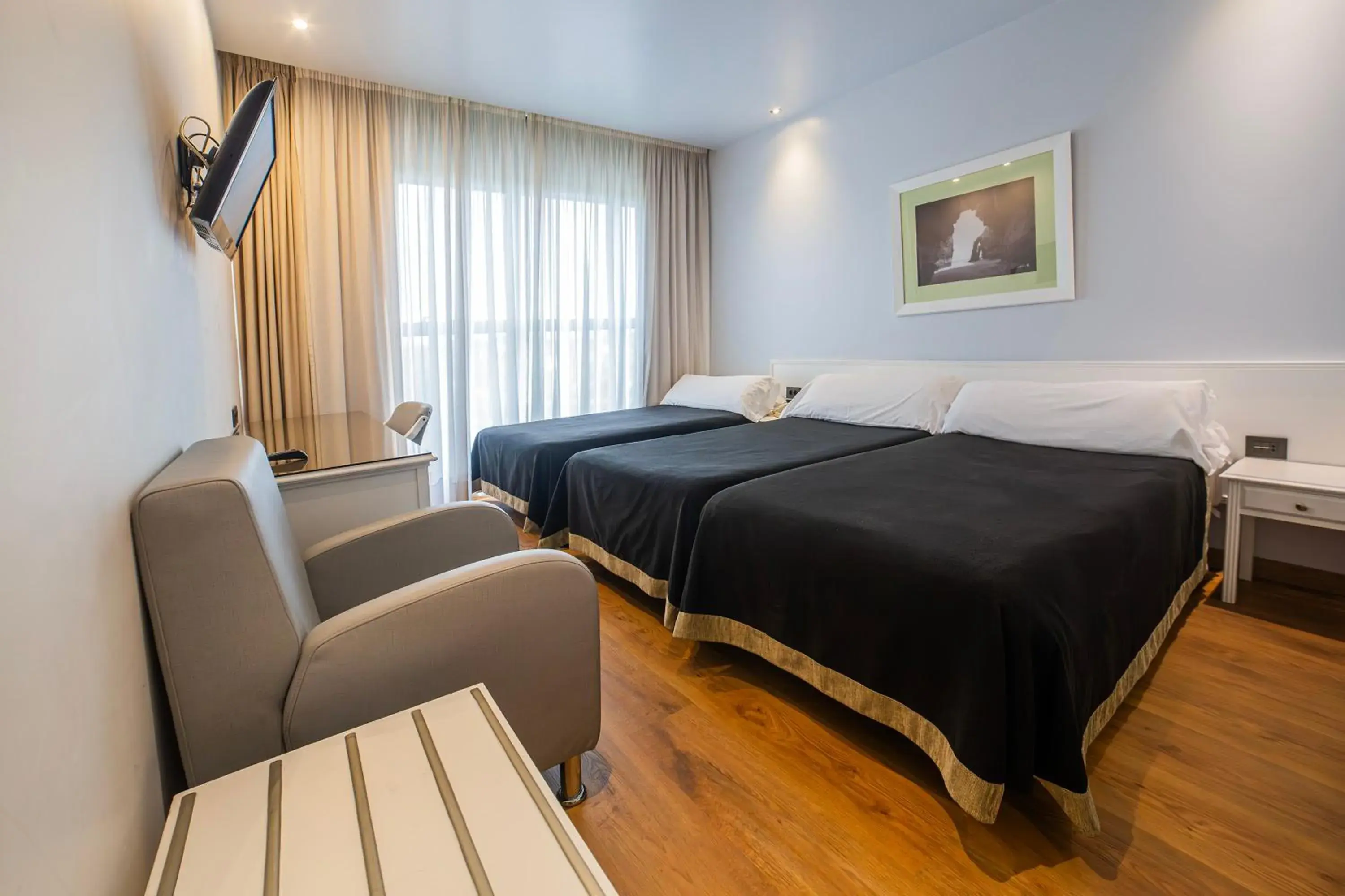 Photo of the whole room, Bed in Hotel Auditorio Santiago & Spa Photo of the whole room, Bed in Hotel Auditorio Santiago & Spa