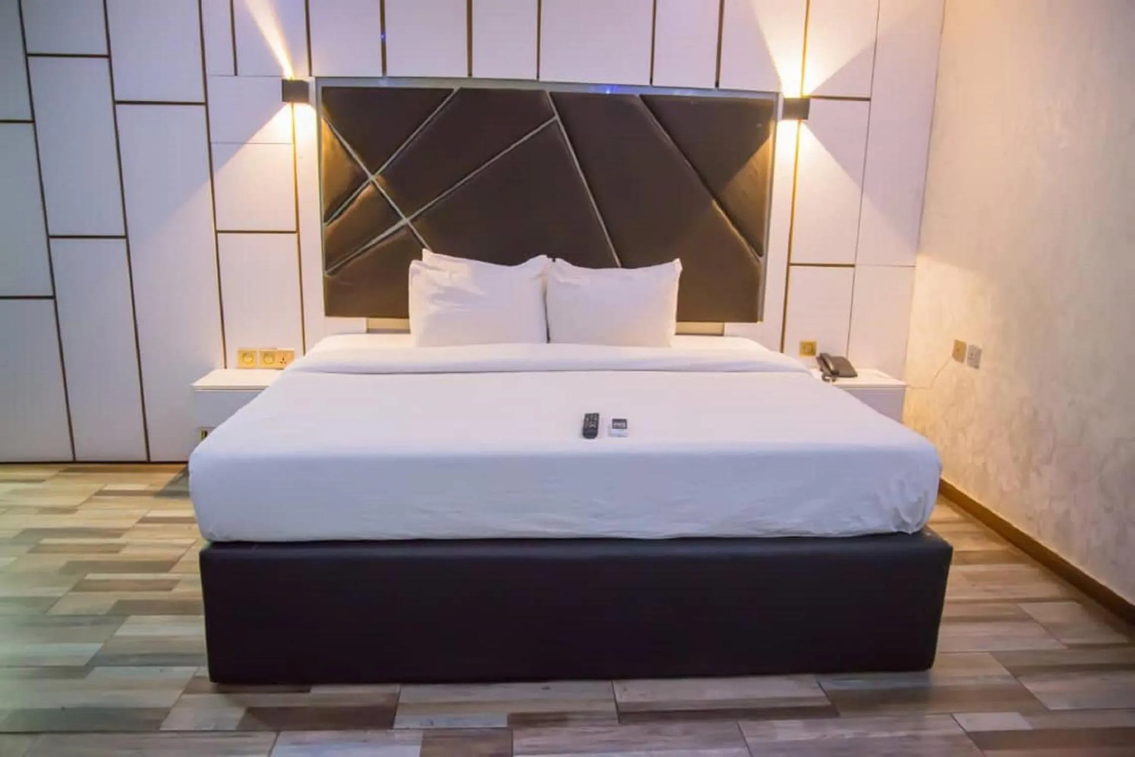 Bed in TNK Hotels