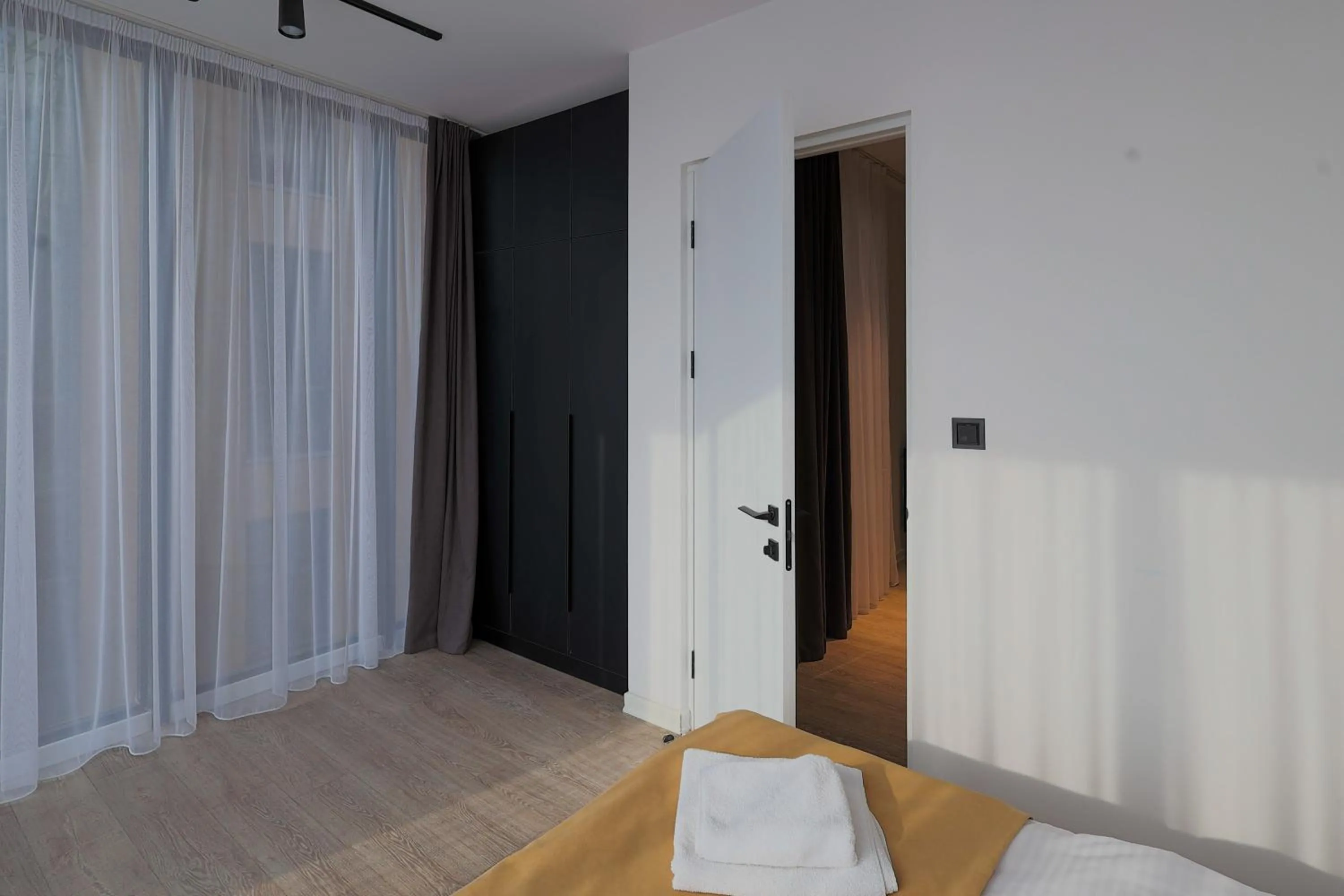 wardrobe, Bed in Welcome Republic Square Apartments