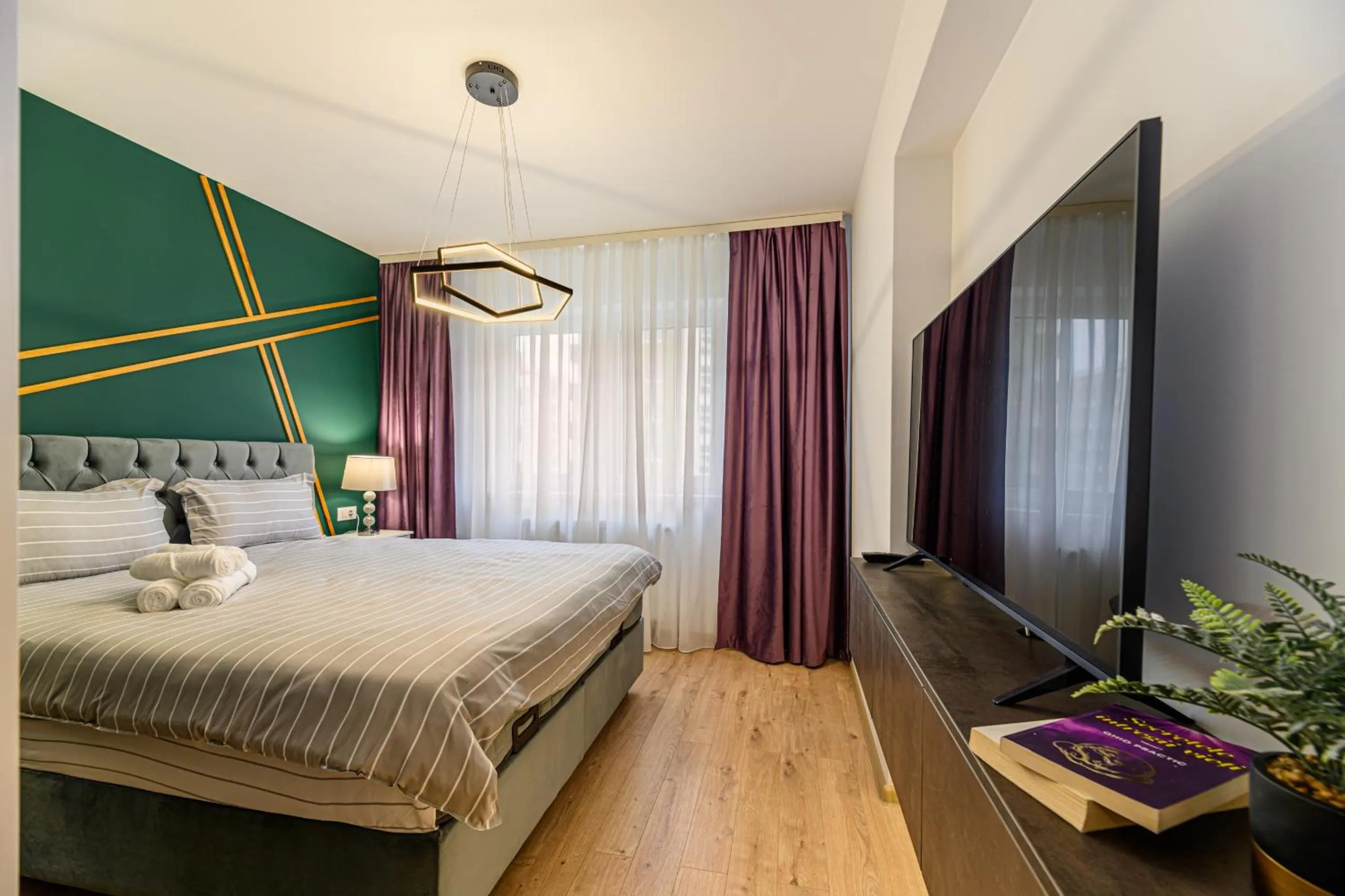 TV and multimedia, Bed in MoHost Blue Moon Apartments