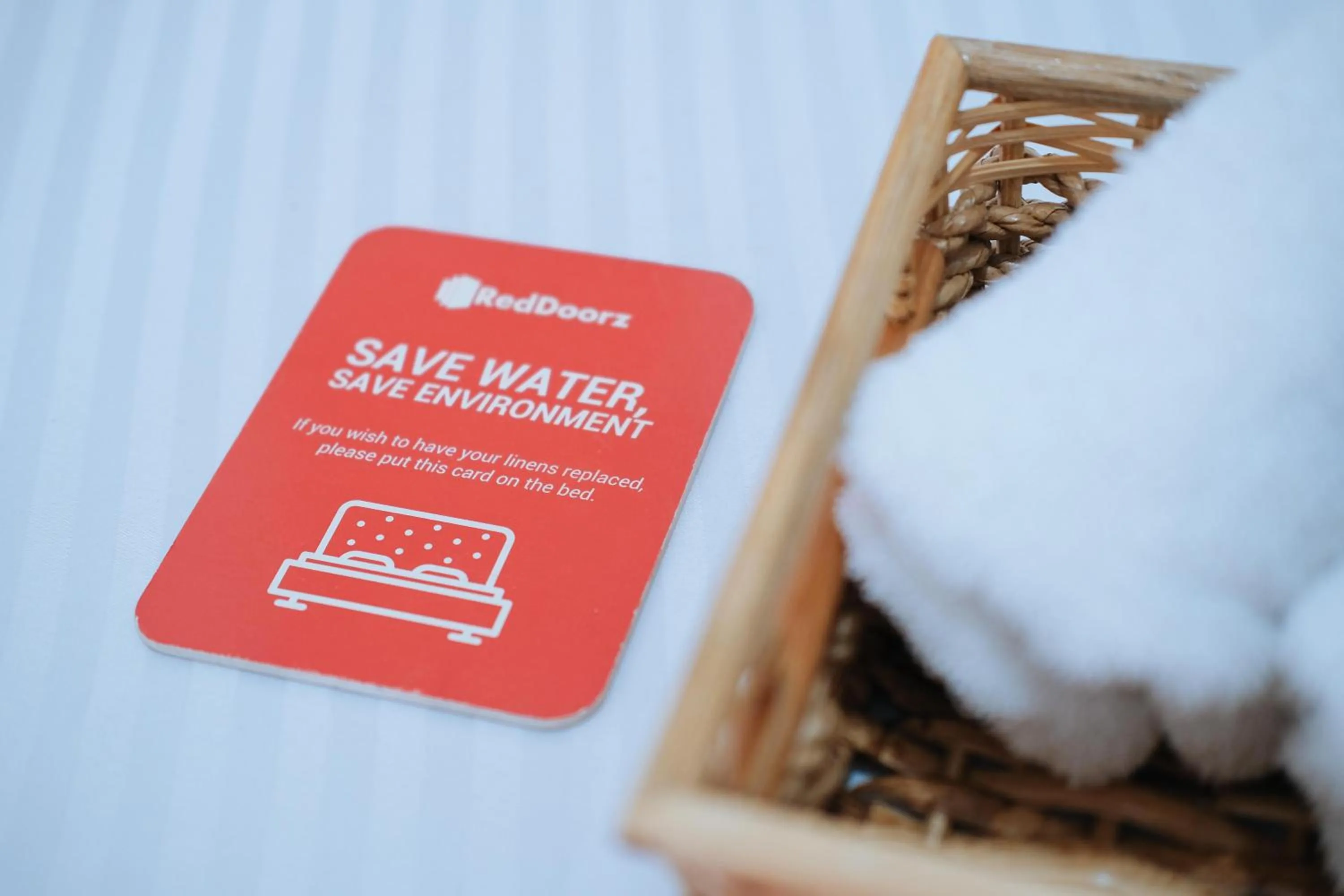 Property logo or sign in Sinoben Apartments by RedDoorz