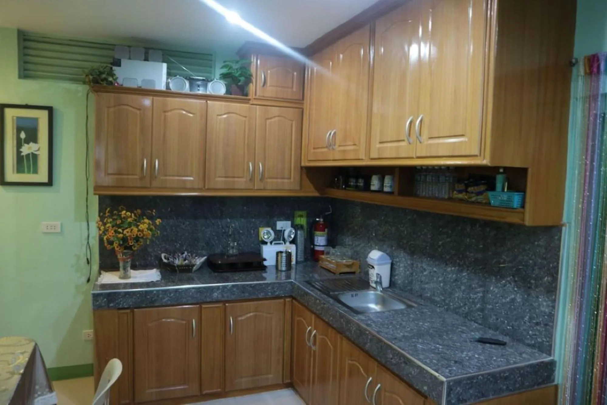 kitchen in Sinoben Apartments by RedDoorz