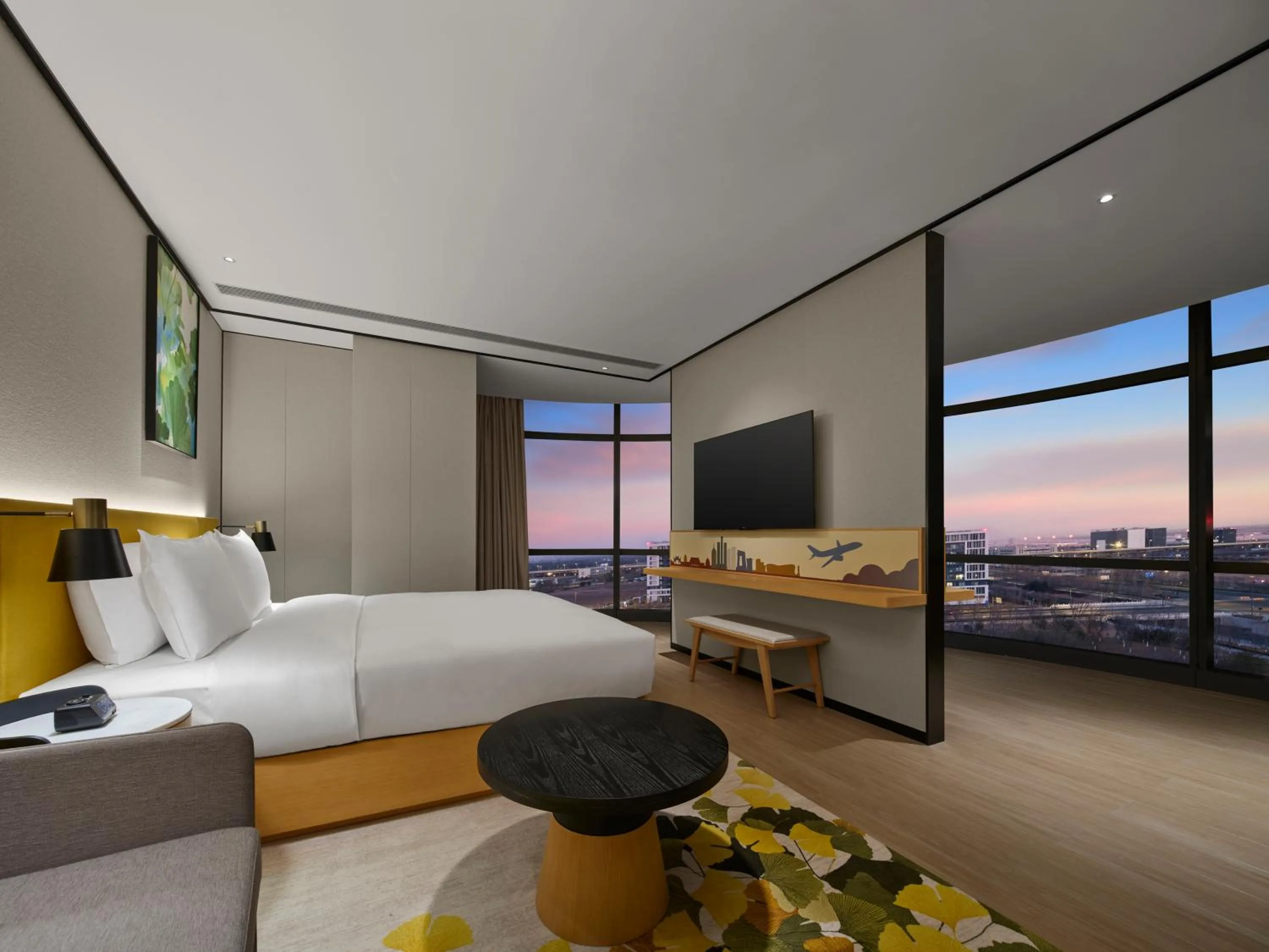 Communal lounge/ TV room, Bed in Hilton Garden Inn Beijing Daxing International Airport