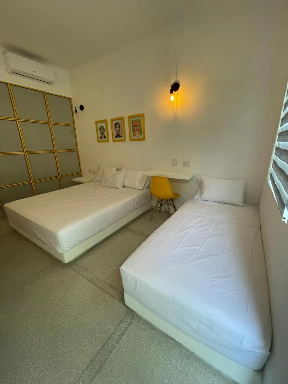 Bed in OASIS TROPICAL HOTEL