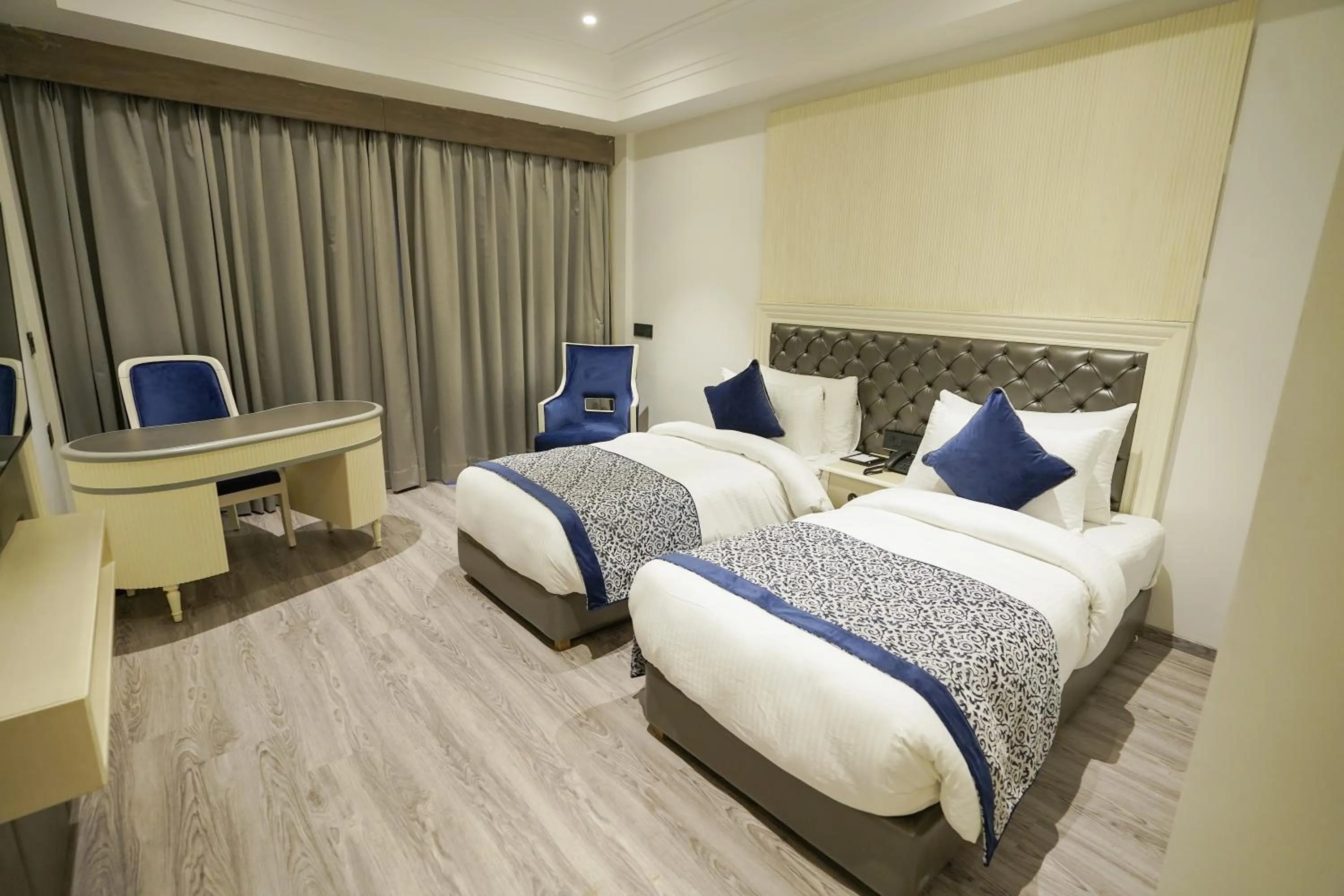 Bed in The Grand Nirvana Hotel