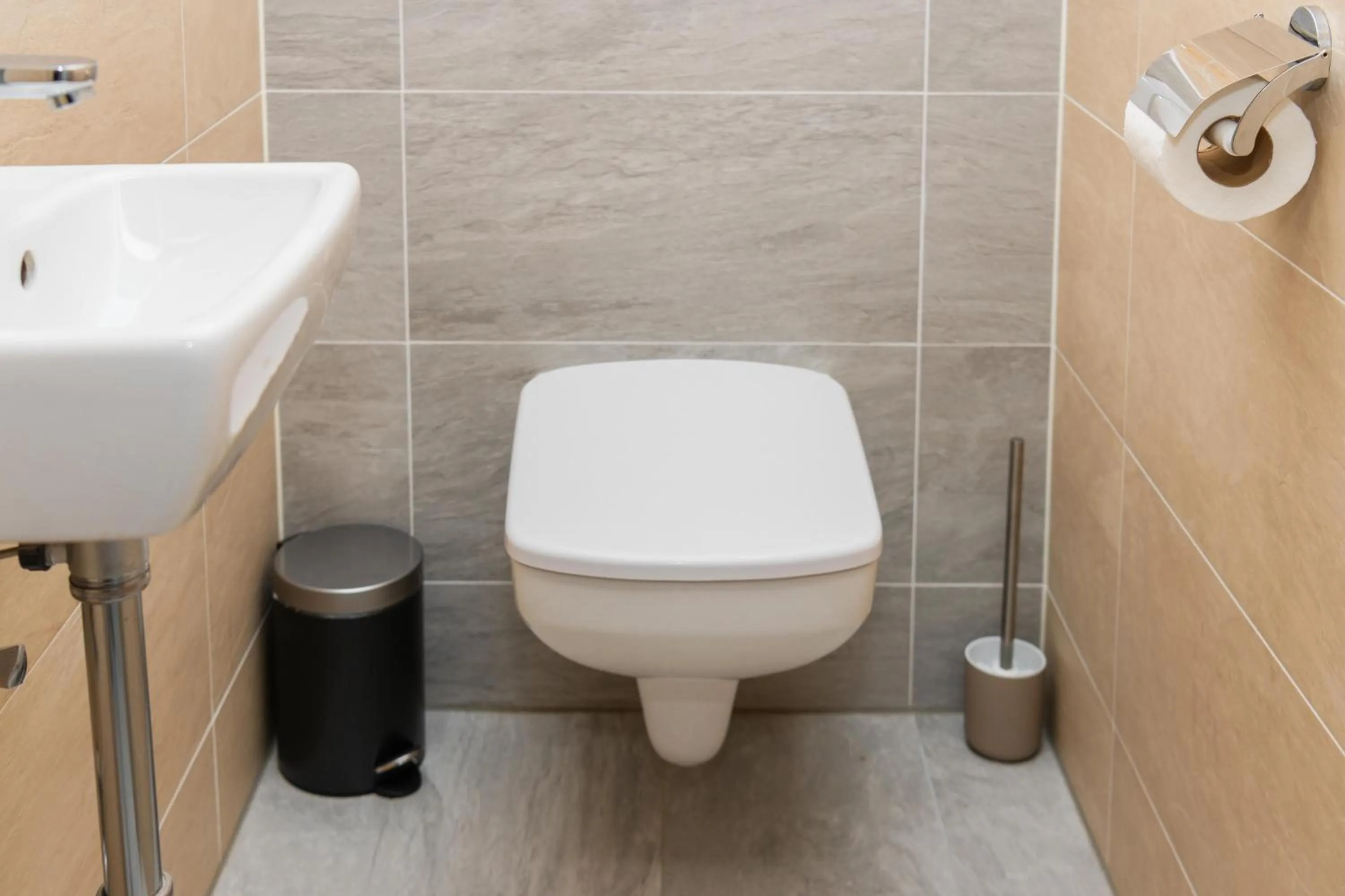 Toilet in WaterFront City Apartments by FirstHost