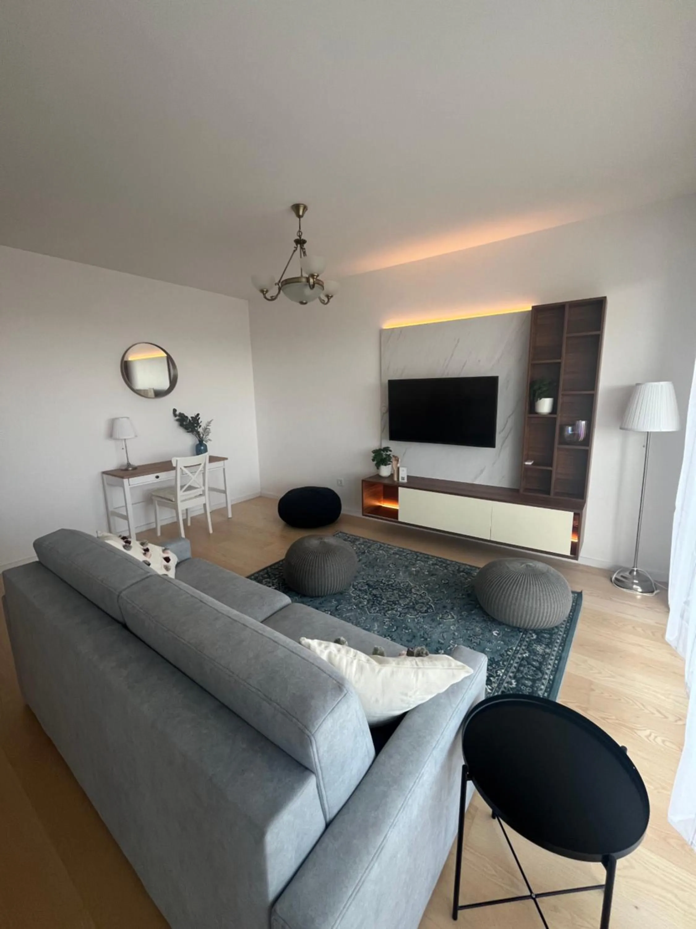 Communal lounge/ TV room in WaterFront City Apartments by FirstHost