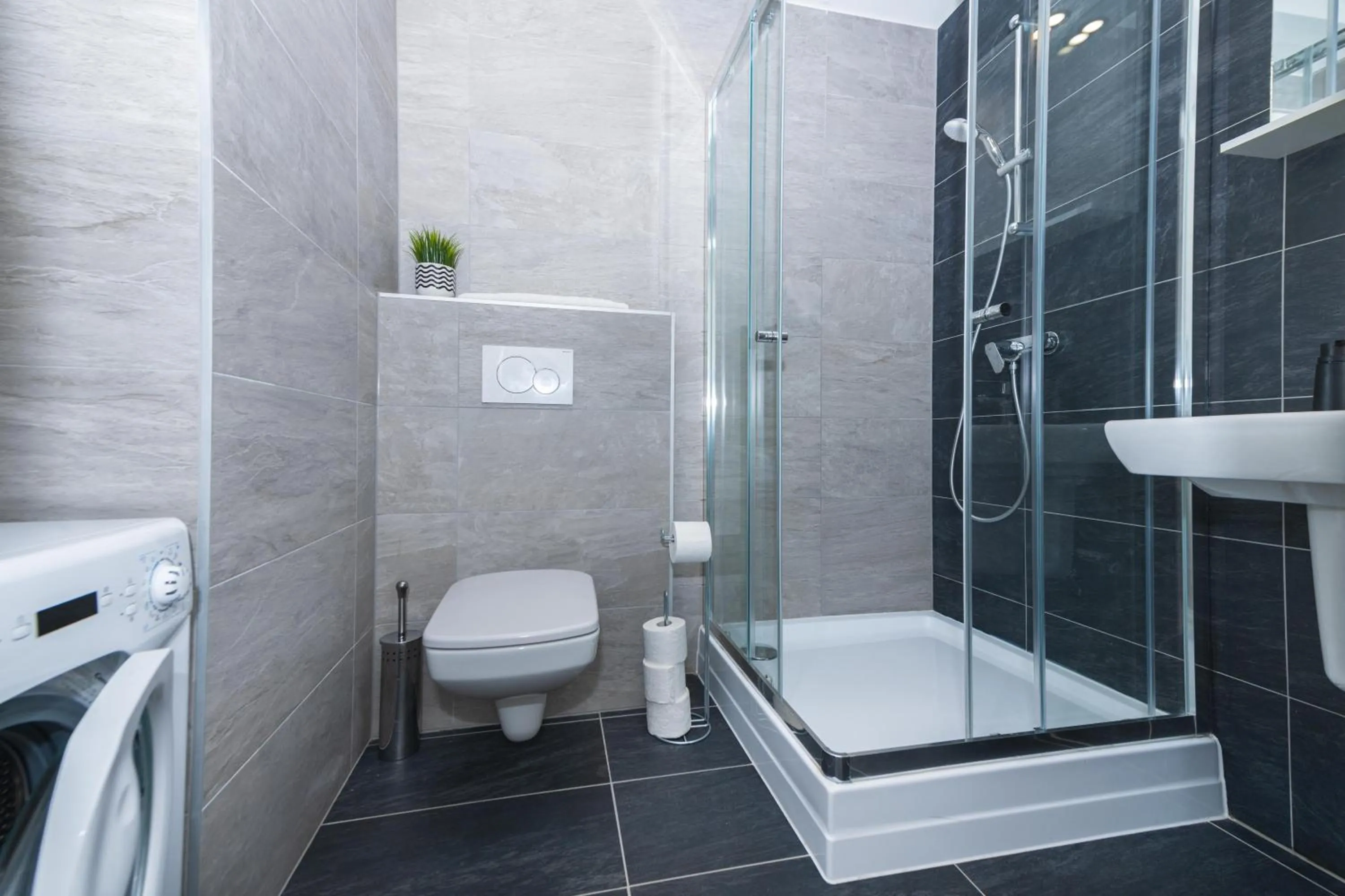 Shower in WaterFront City Apartments by FirstHost