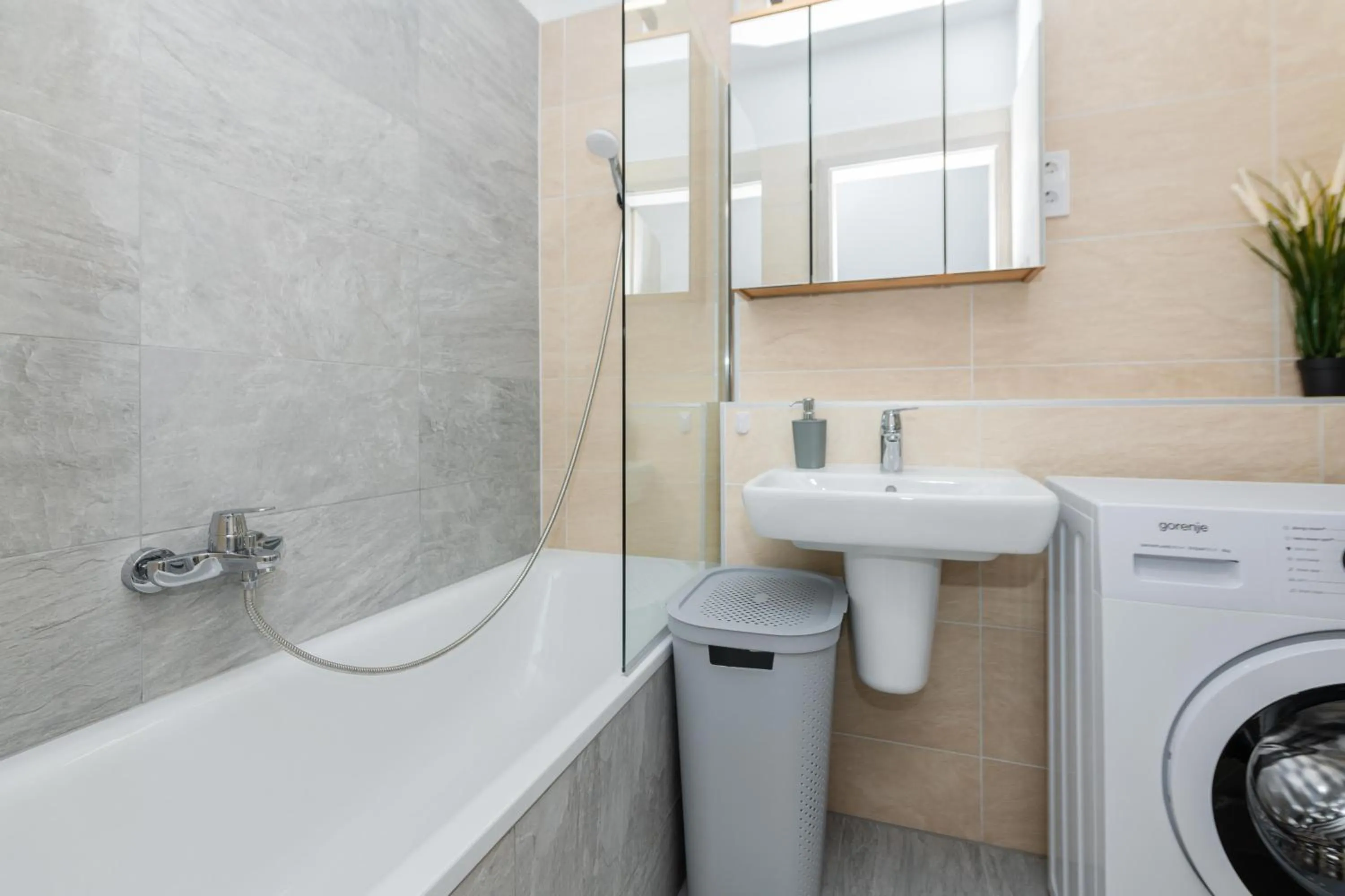 Shower in WaterFront City Apartments by FirstHost