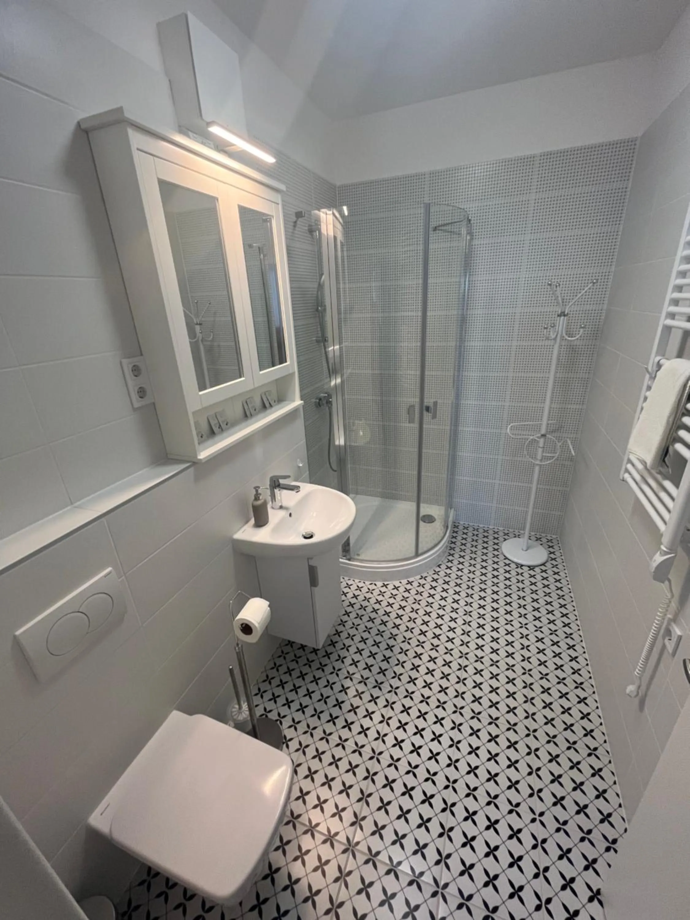 Shower in WaterFront City Apartments by FirstHost