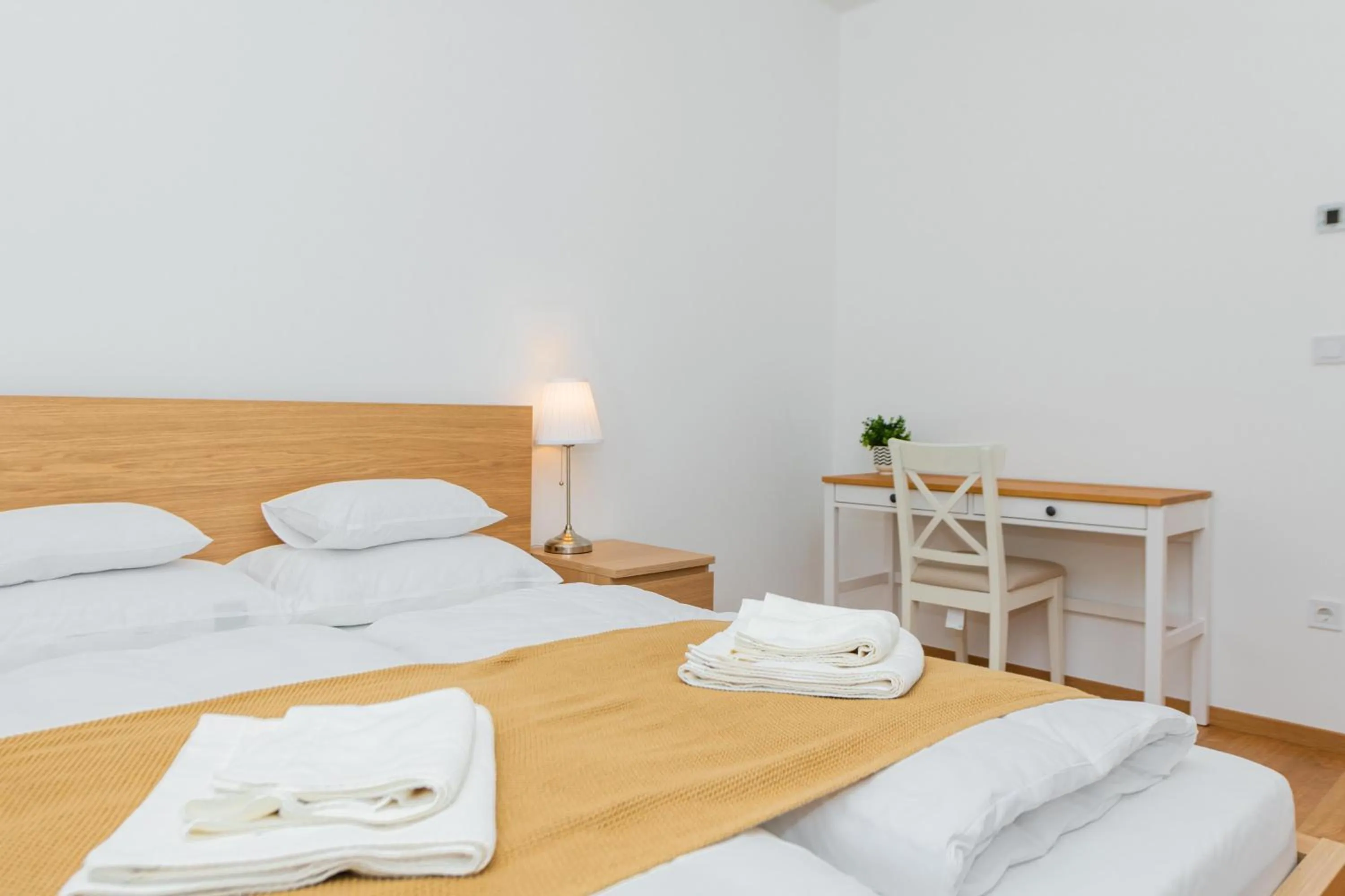 Bed in WaterFront City Apartments by FirstHost