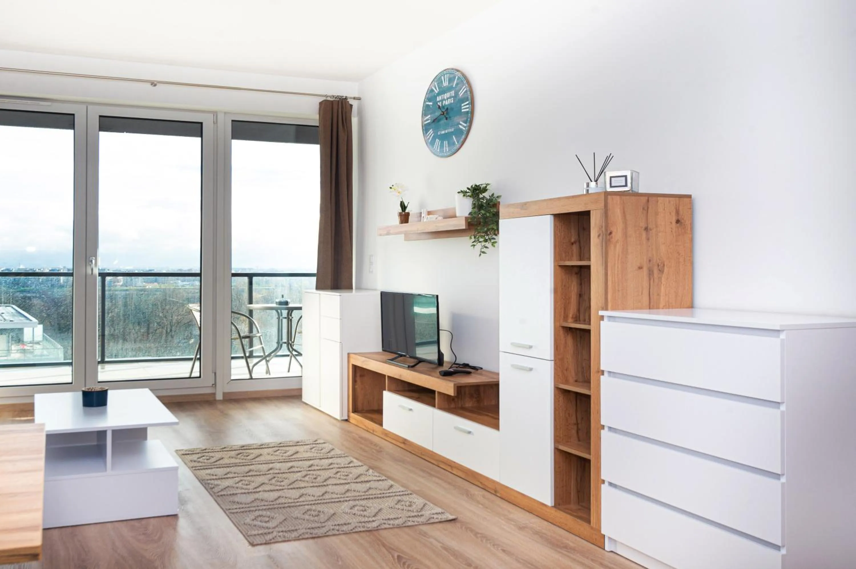 Communal lounge/ TV room in WaterFront City Apartments by FirstHost