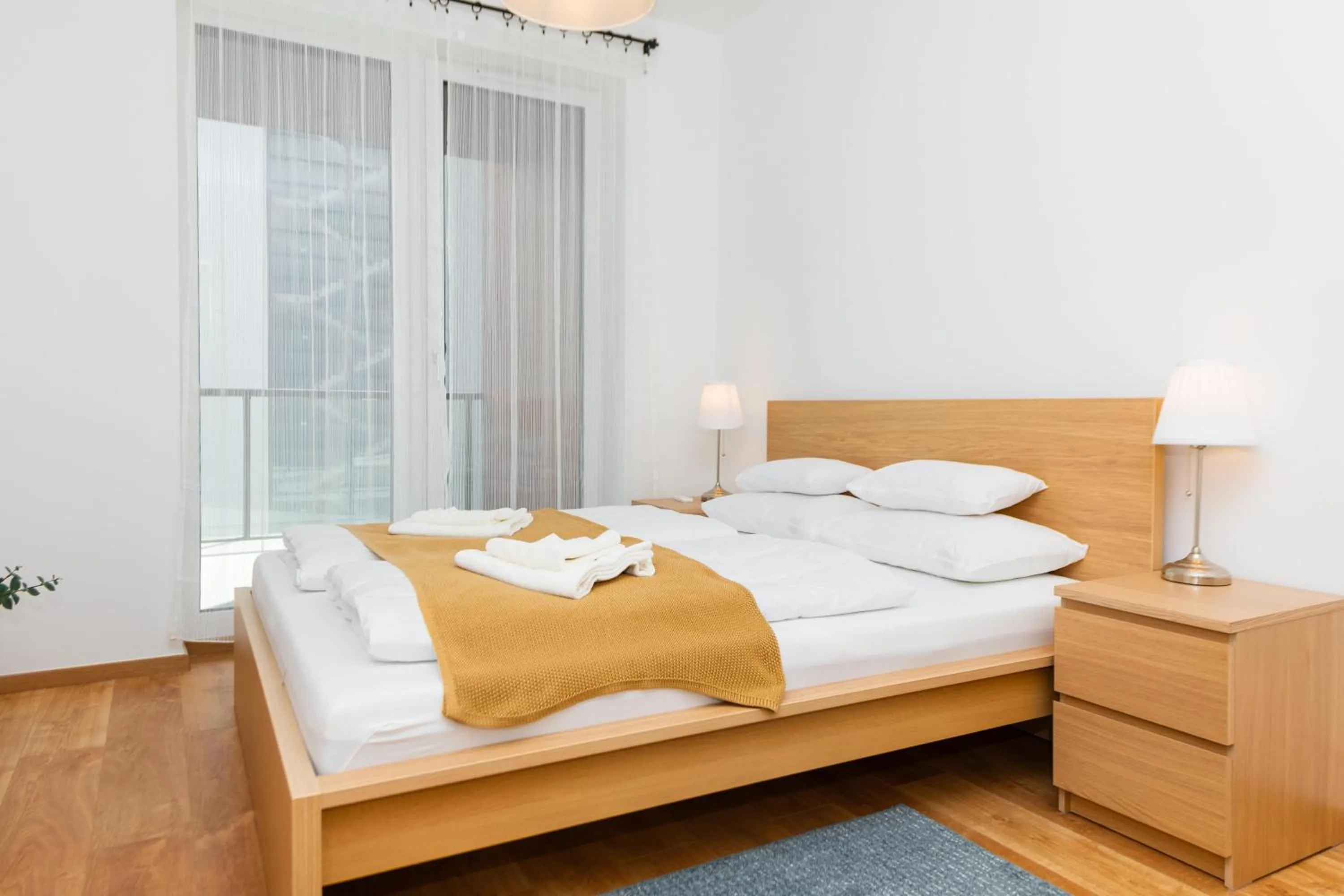 Bed in WaterFront City Apartments by FirstHost