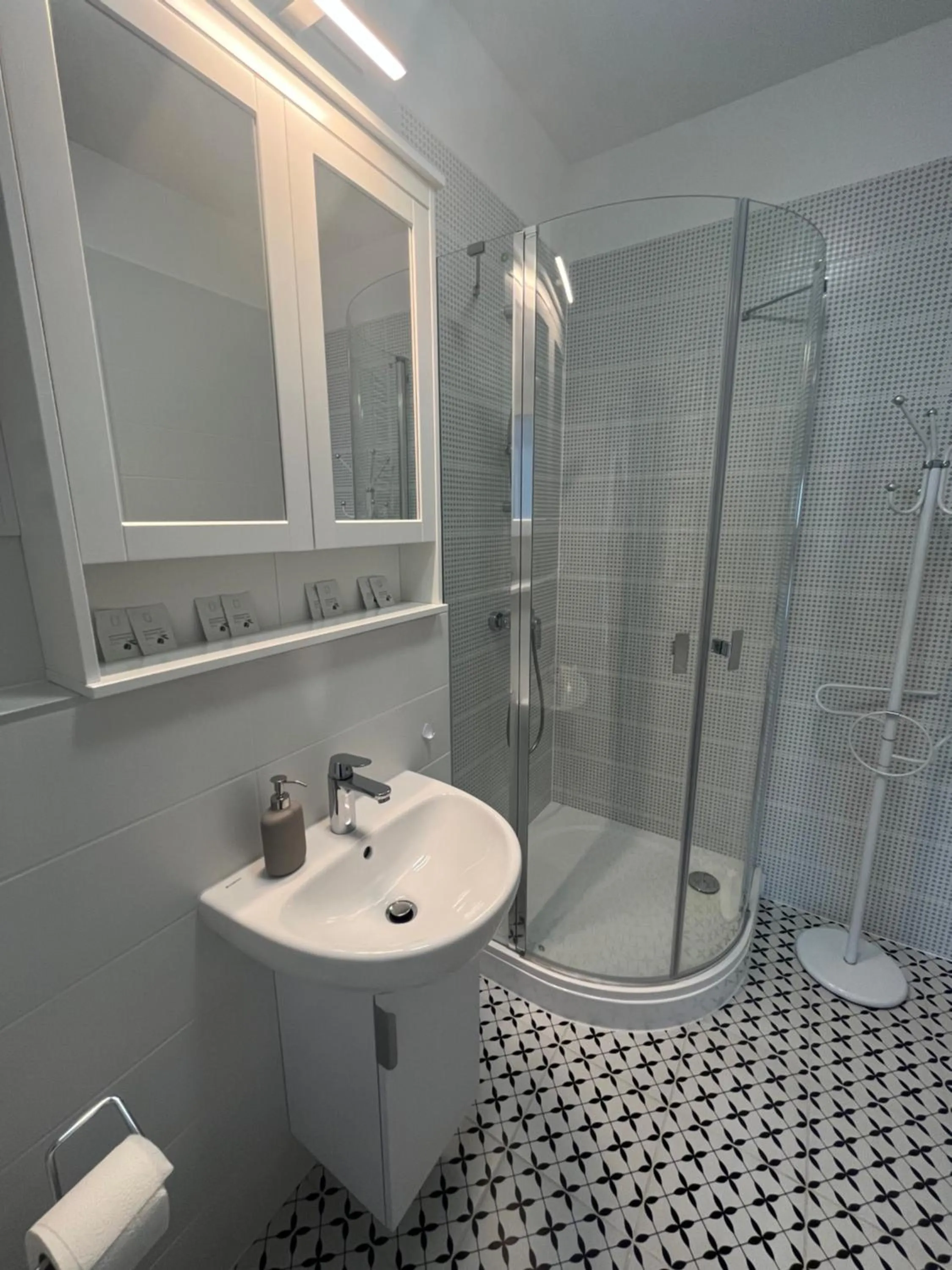 Shower in WaterFront City Apartments by FirstHost