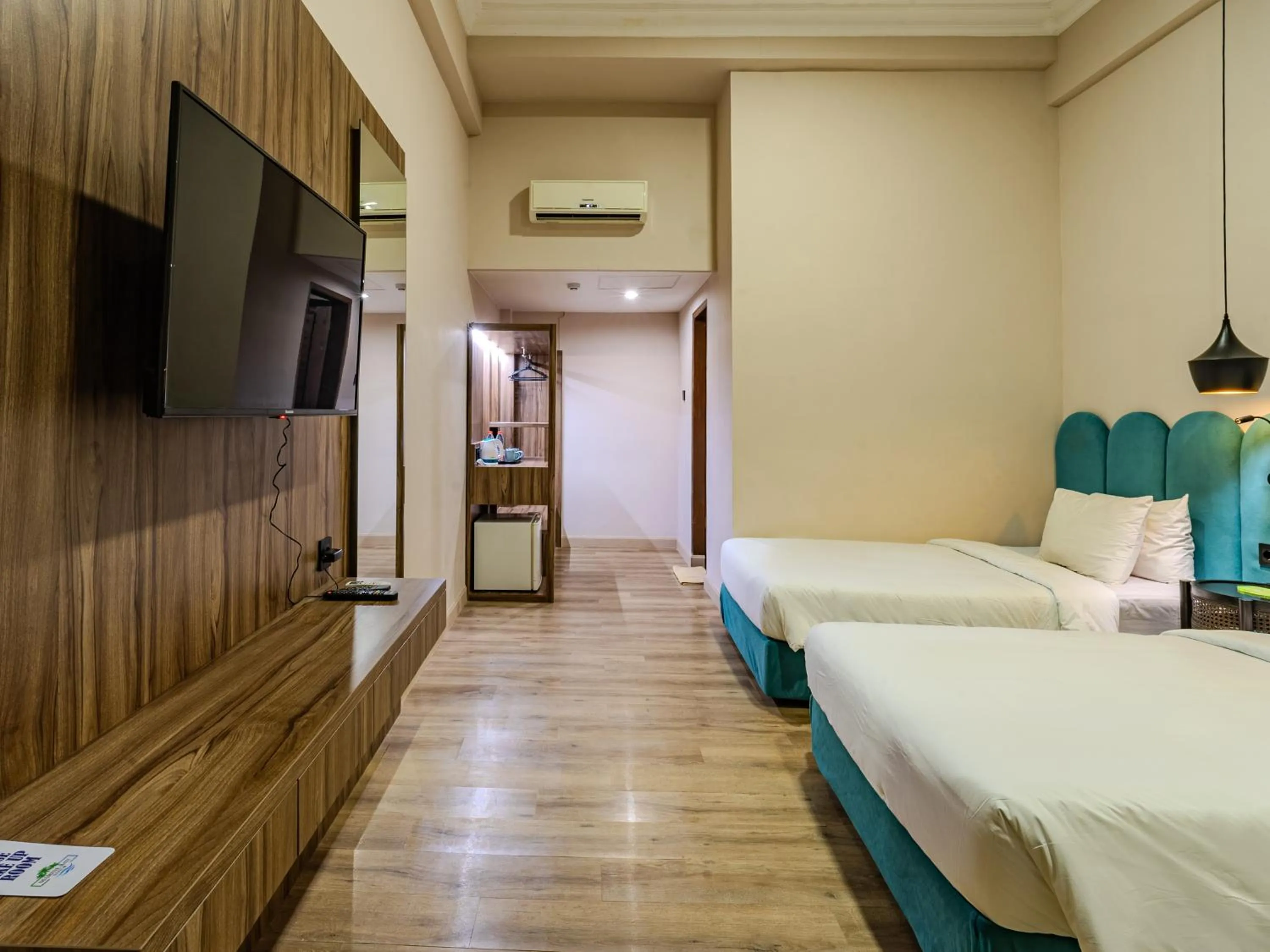 Communal lounge/ TV room, Bed in Marine Bay Sanur