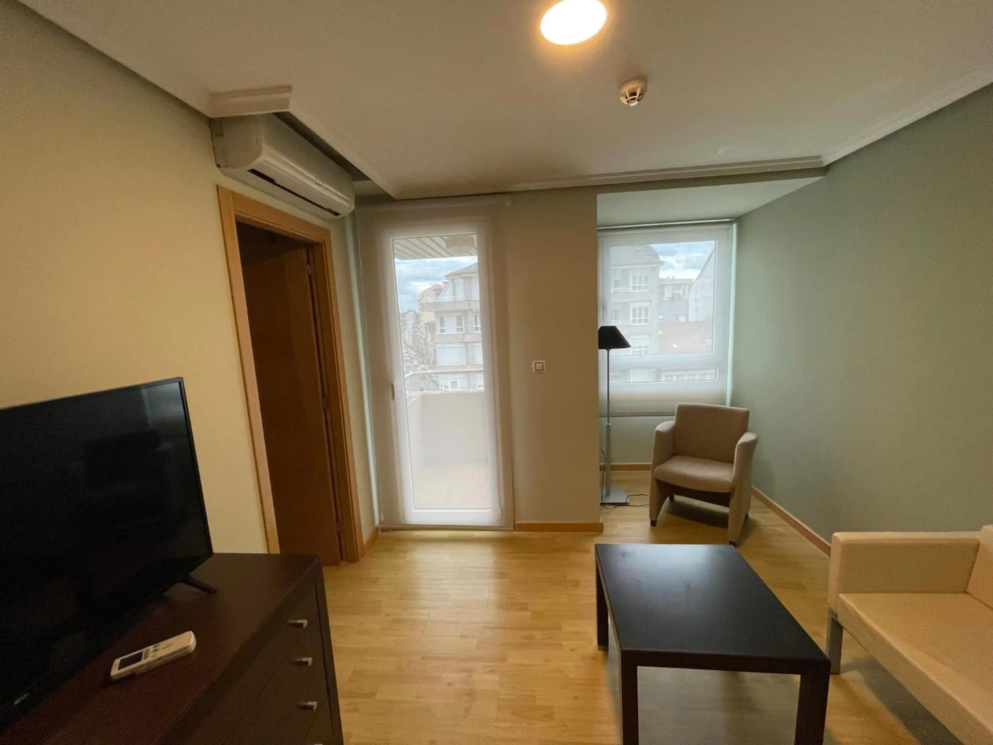 Living room in Aparthotel Arenteiro