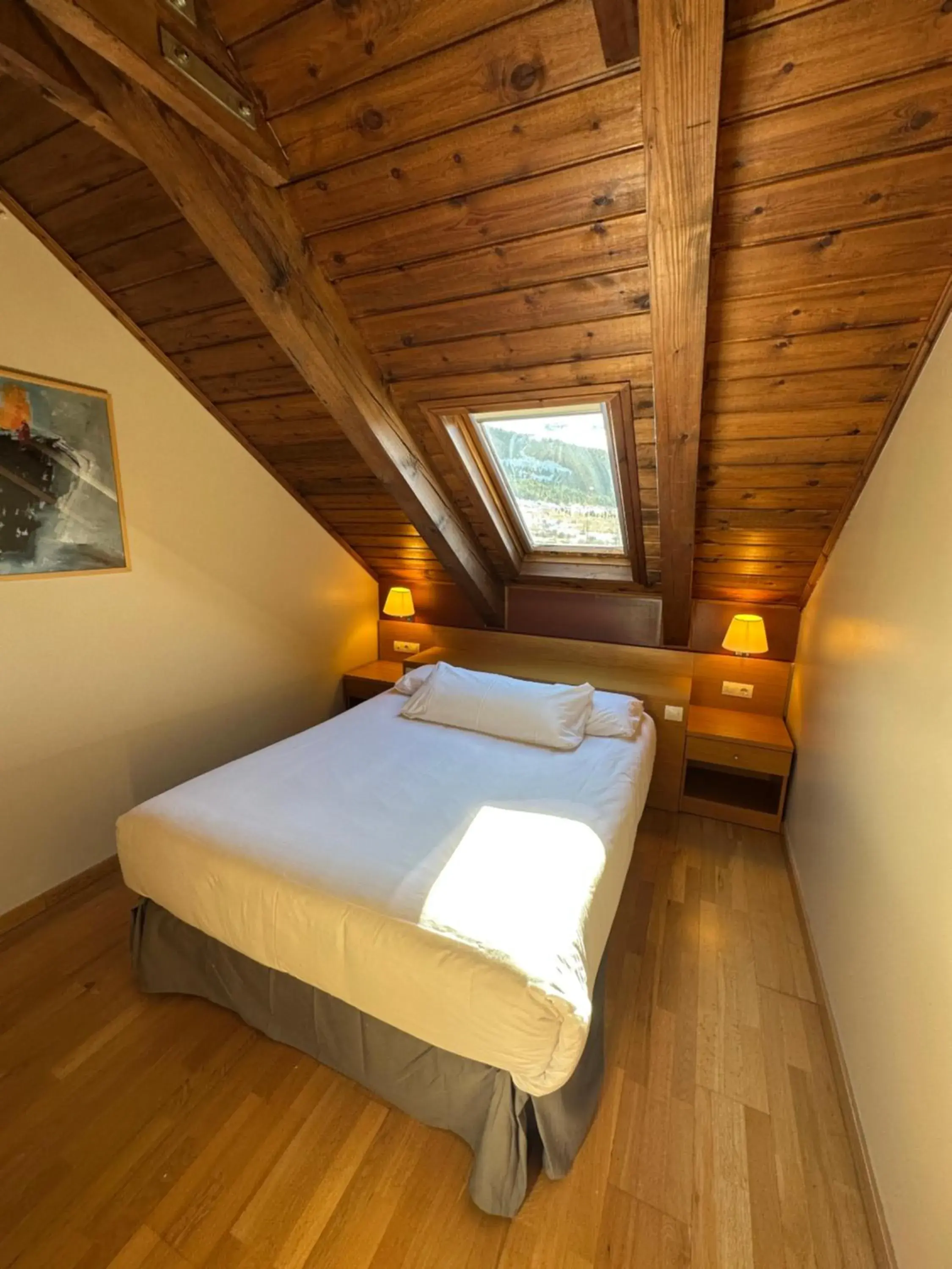 Bed in Aparthotel Siente Boí & SPA Bed in Aparthotel Siente Boí & SPA