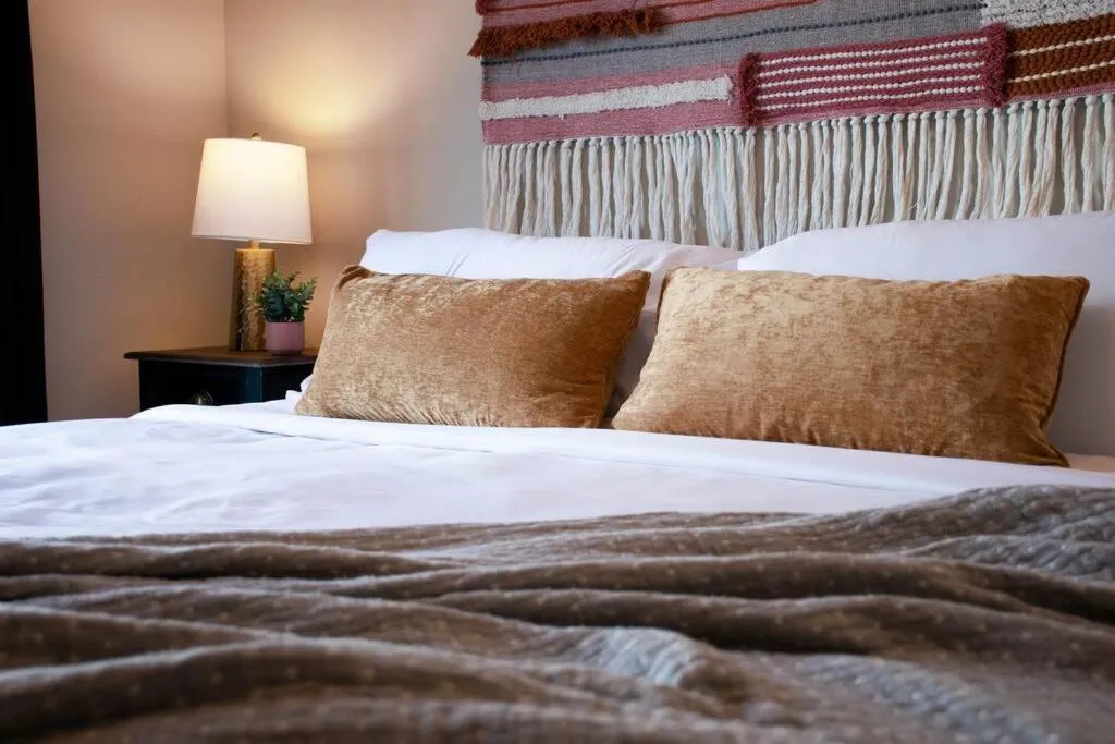 Bed in Bright Luxe Condo, AC, Top Floor, King Bed, Balcony!