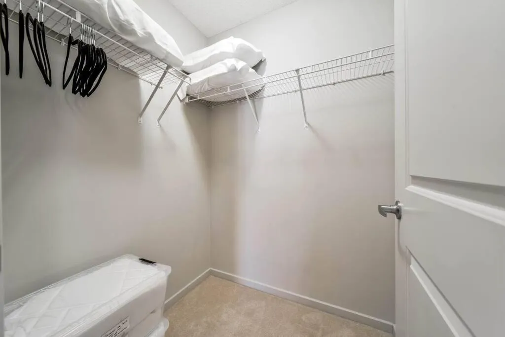 wardrobe in Bright Luxe Condo, AC, Top Floor, King Bed, Balcony!