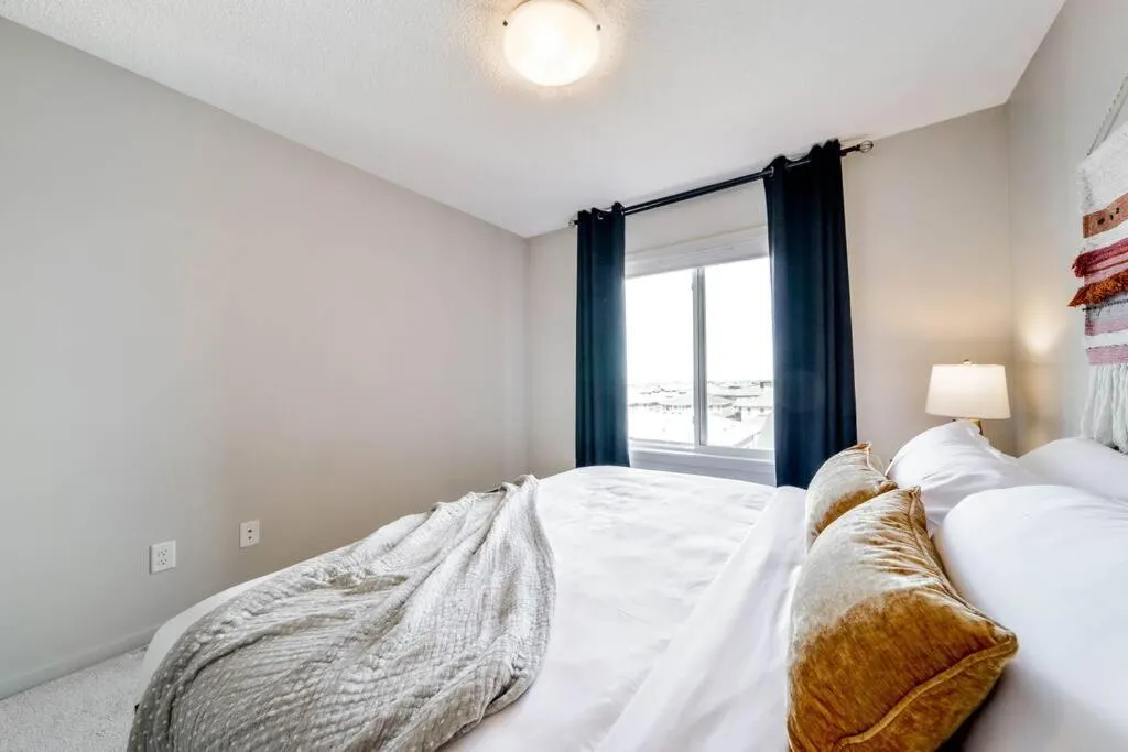 Bed in Bright Luxe Condo, AC, Top Floor, King Bed, Balcony!